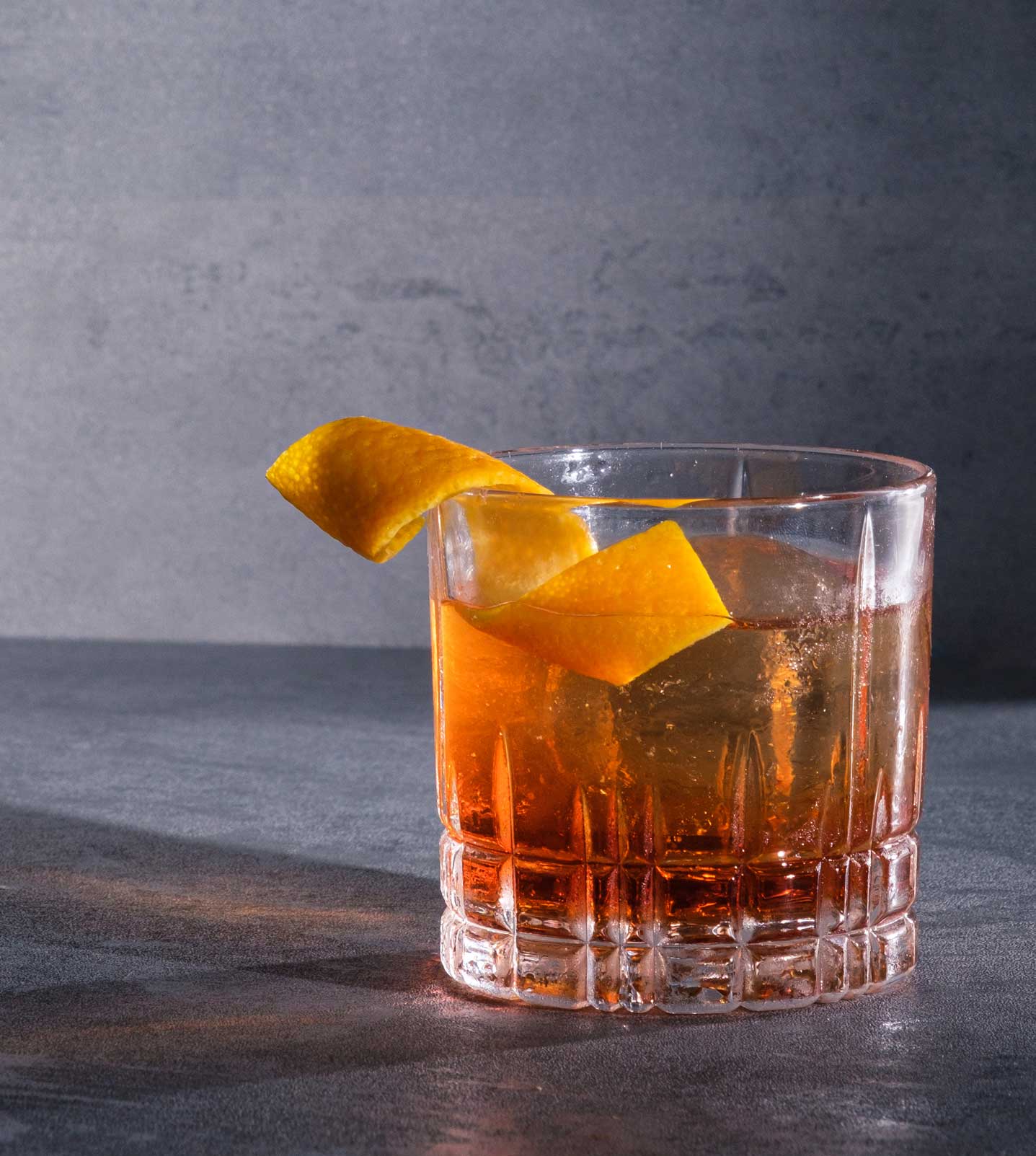 An example of the Haus Negroni, the mixed drink (cocktail) featuring Hayman’s Royal Dock Navy Strength Gin, Aperitivo Cappelletti, and Dolin Rouge Vermouth de Chambéry; photo by Miranda Hodge