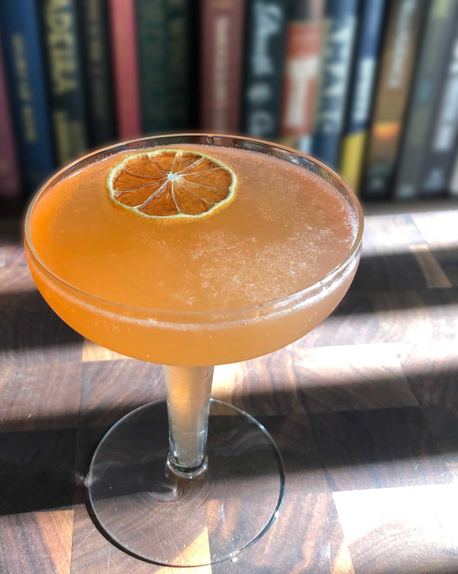 An example of the Front Porch Fizz, the mixed drink (fizz), adapted from a drink by Kellie Thorn, Empire State South, Atlanta, Georgia, featuring sparkling wine, Hayman’s London Dry Gin, Aperitivo Cappelletti, watermelon syrup, and lemon juice; photo by Lee Edwards