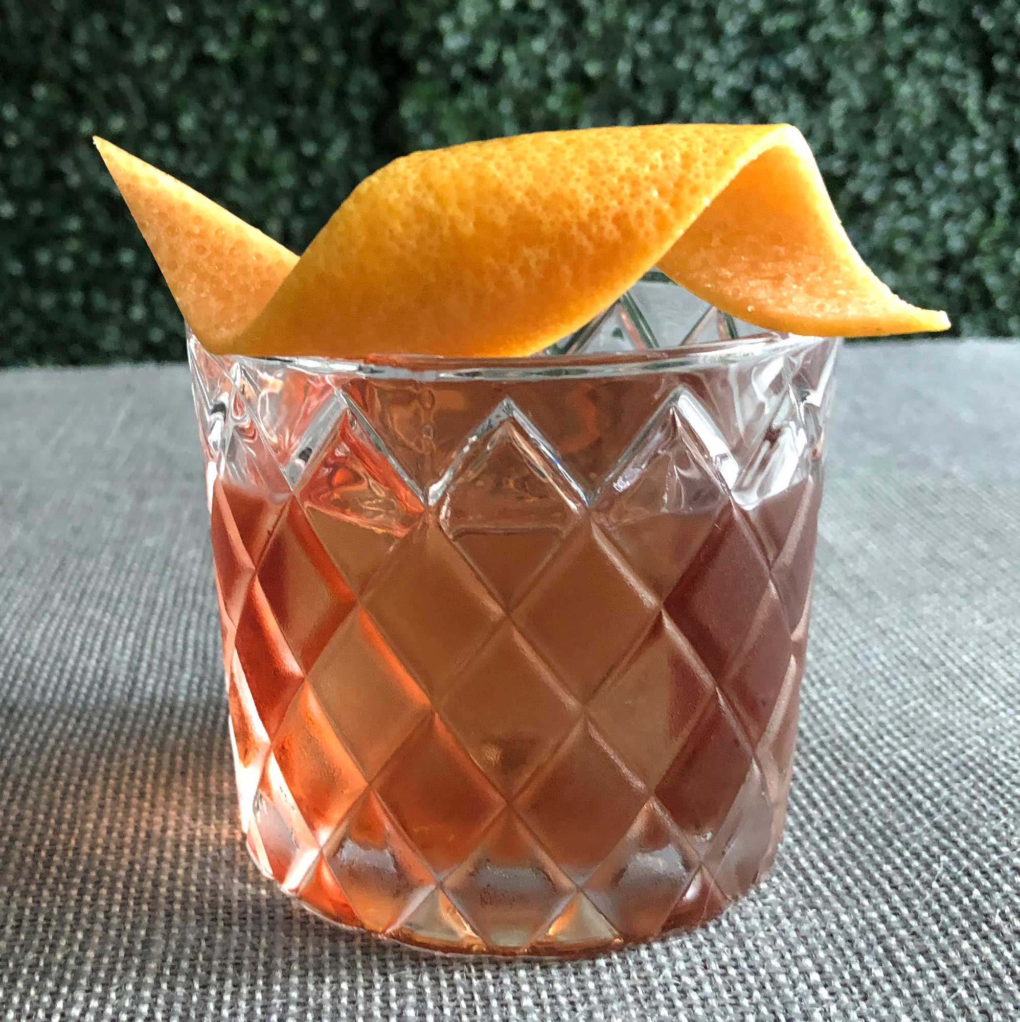 An example of the Count of Mount Kisco, the mixed drink (cocktail), by Scott Krahn, New York City, featuring Averell Damson Plum Gin Liqueur, Dolin Dry Vermouth de Chambéry, and Salers Gentian Apéritif; photo by Lee Edwards