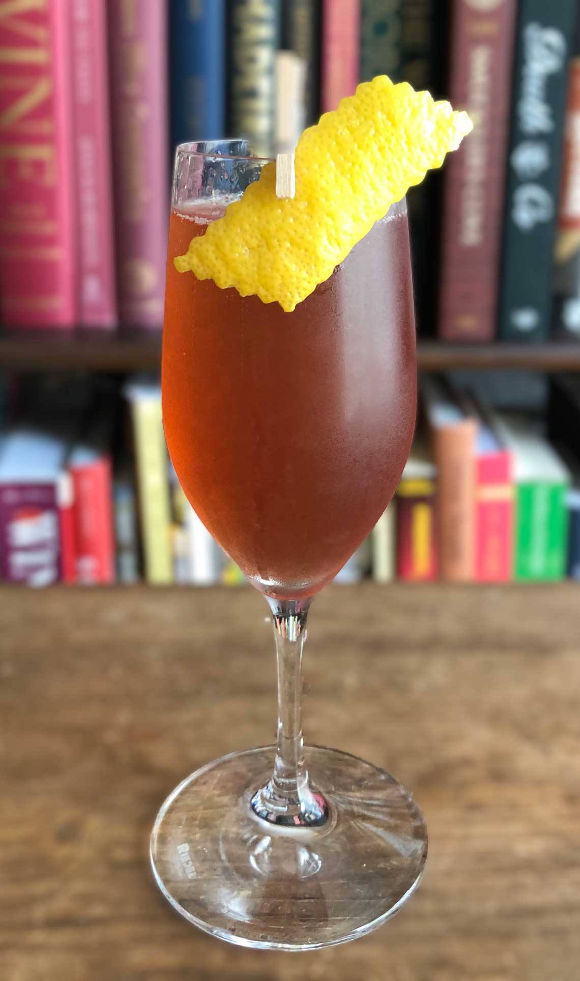 An example of the Damson Royale, the mixed drink (cocktail) featuring sparkling wine, Averell Damson Plum Gin Liqueur, and lemon juice; photo by Lee Edwards