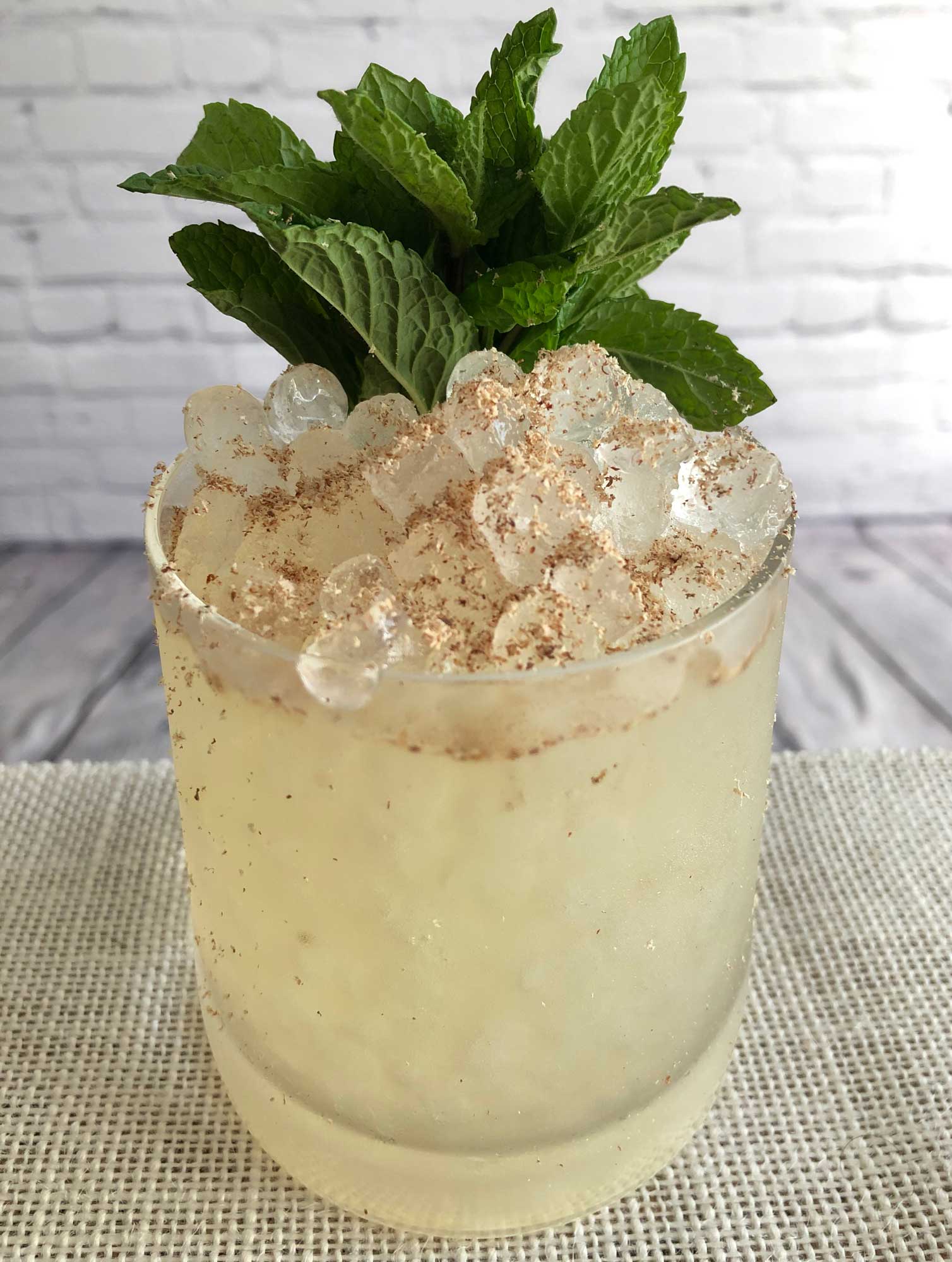 An example of the South Seas Swizzle, the mixed drink (frappe), by Nick Bennett, Porchlight, NYC, featuring Batavia Arrack van Oosten, lime juice, green tea syrup, and Regans’ No. 6 Orange Bitters; photo by Lee Edwards