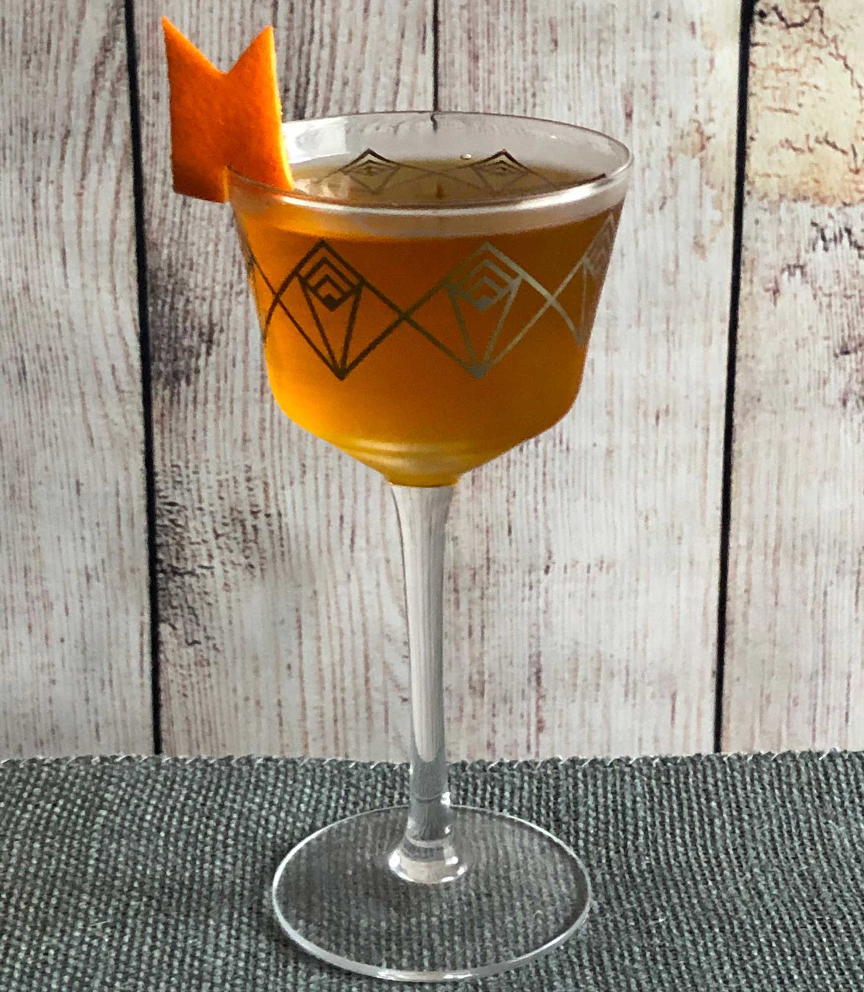 An example of the Accidental Cocktail, the mixed drink (cocktail), adapted from the Occidental, PDT, New York City, featuring Batavia Arrack van Oosten, orange-flavored liqueur, Cardamaro Vino Amaro, and Elisir Novasalus; photo by Lee Edwards