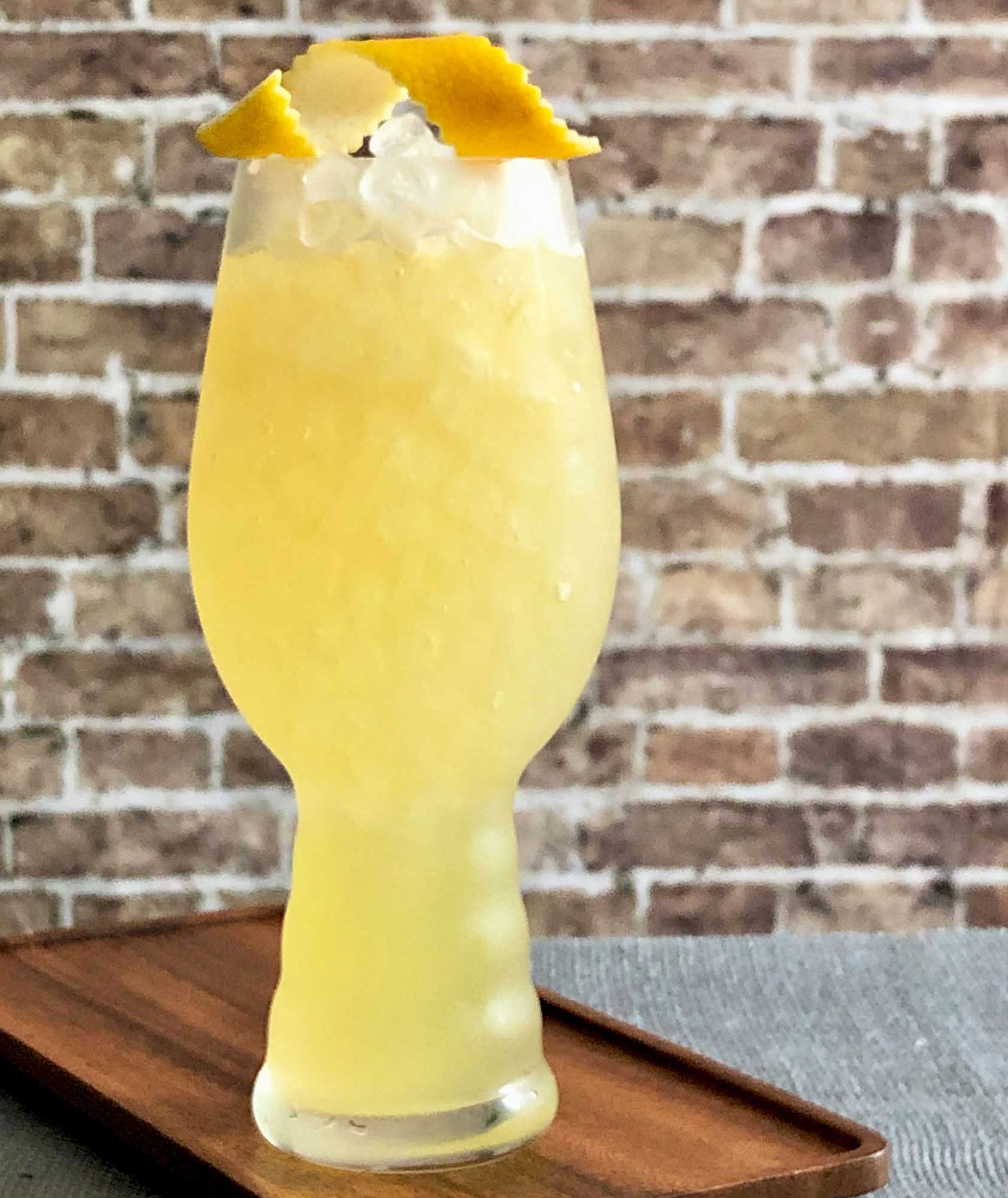 An example of the Strange Brew, the mixed drink (cocktail), adapted from a drink from Death & Co., New York City, featuring india pale ale, Hayman’s London Dry Gin, pineapple juice, John D. Taylor’s Velvet Falernum, and lemon juice; photo by Lee Edwards
