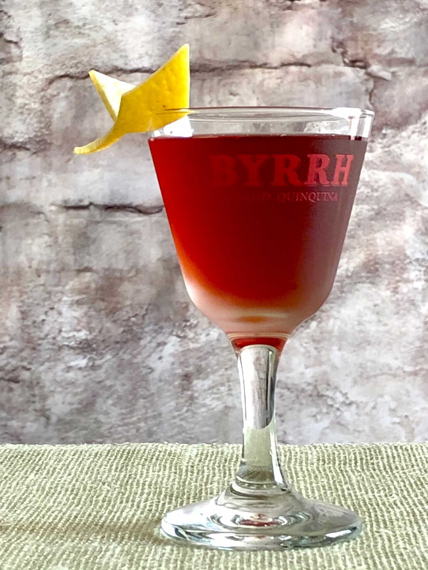 An example of the Betsy Ross, the mixed drink (cocktail), by David Embury, The Fine Art of Mixing Drinks, featuring grape brandy, Byrrh Grand Quinquina, curaçao, and Angostura bitters; photo by Lee Edwards