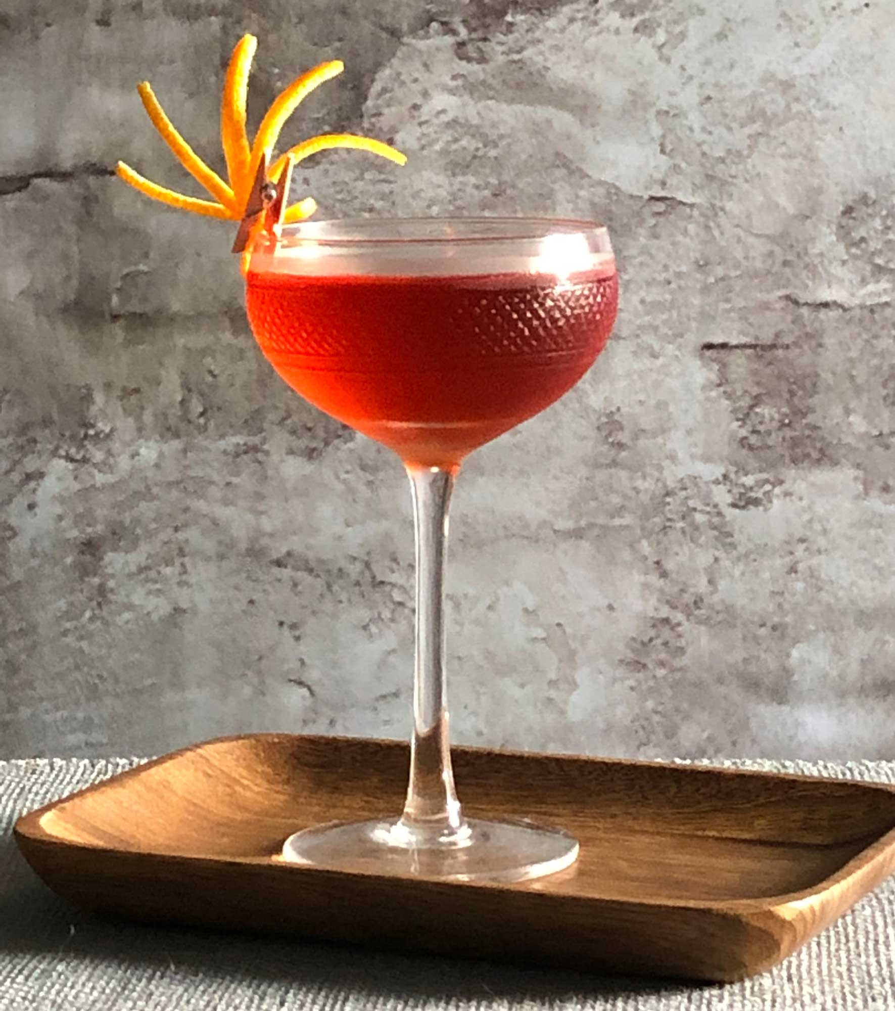 An example of the Negroni Rosa, the mixed drink (cocktail) featuring Hayman’s London Dry Gin, Cocchi Americano Rosa, and Aperitivo Cappelletti; photo by Lee Edwards