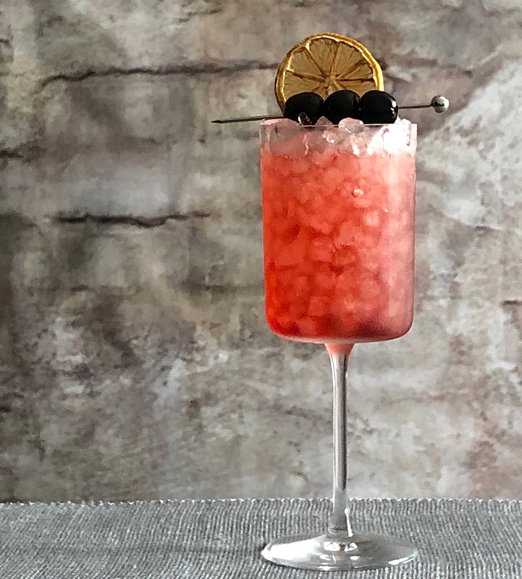 An example of the Cocconato Jubilee, the mixed drink (cocktail) featuring Cocchi Americano Rosa, soda water, and cherry syrup; photo by Lee Edwards