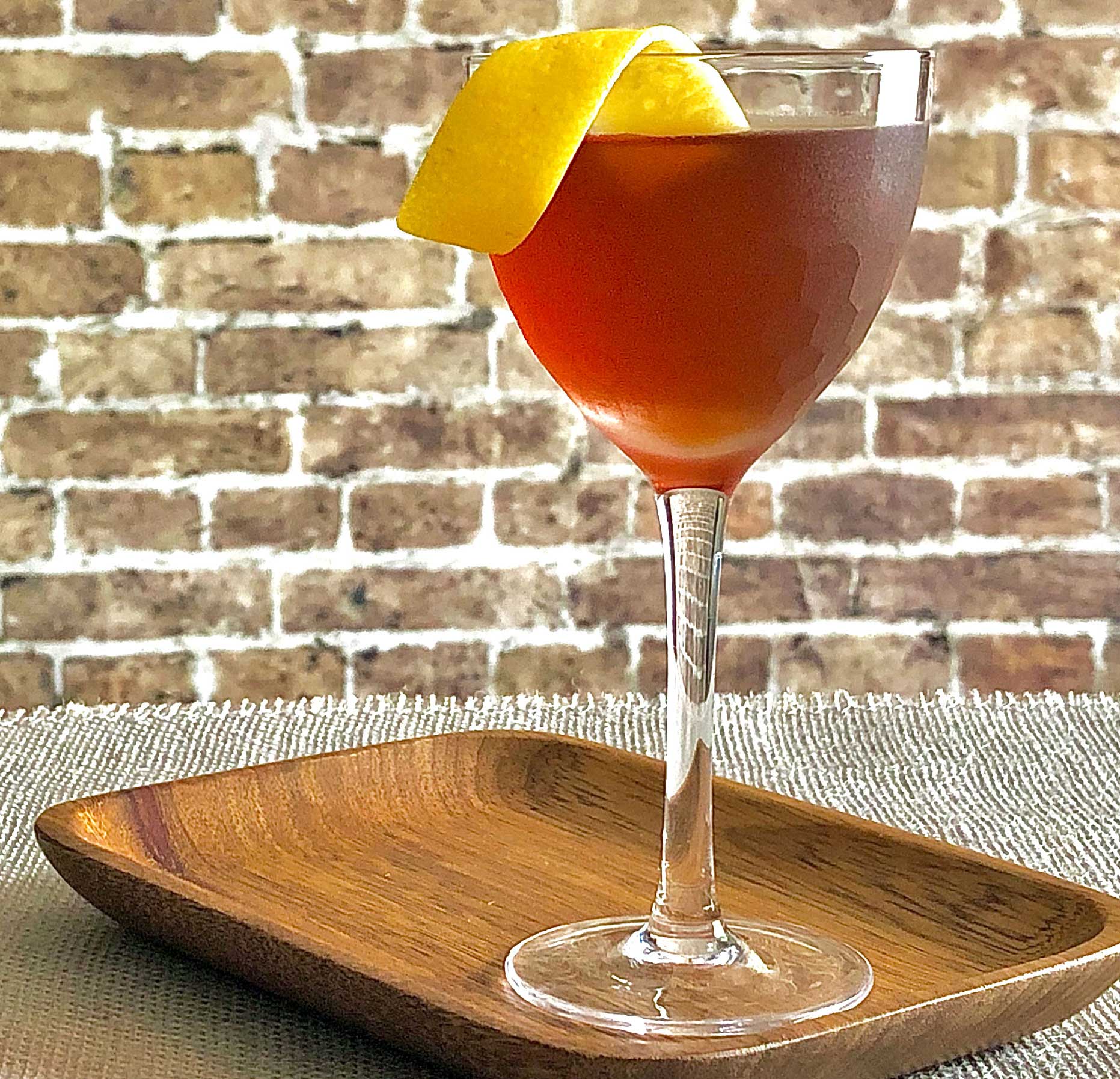 An example of the Fort Point, the mixed drink (cocktail), by Erik Adkins, Heaven’s Dog, San Francisco, featuring rye whiskey, Cocchi Barolo Chinato, and Rothman & Winter Orchard Apricot Liqueur; photo by Lee Edwards