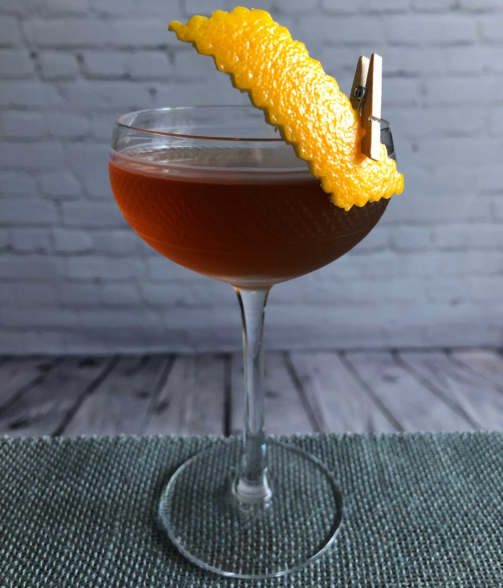 An example of the The Libertine, the mixed drink (cocktail) featuring rye whiskey, Dolin Dry Vermouth de Chambéry, Dolin Rouge Vermouth de Chambéry, Bénédictine, and Angostura bitters; photo by Lee Edwards
