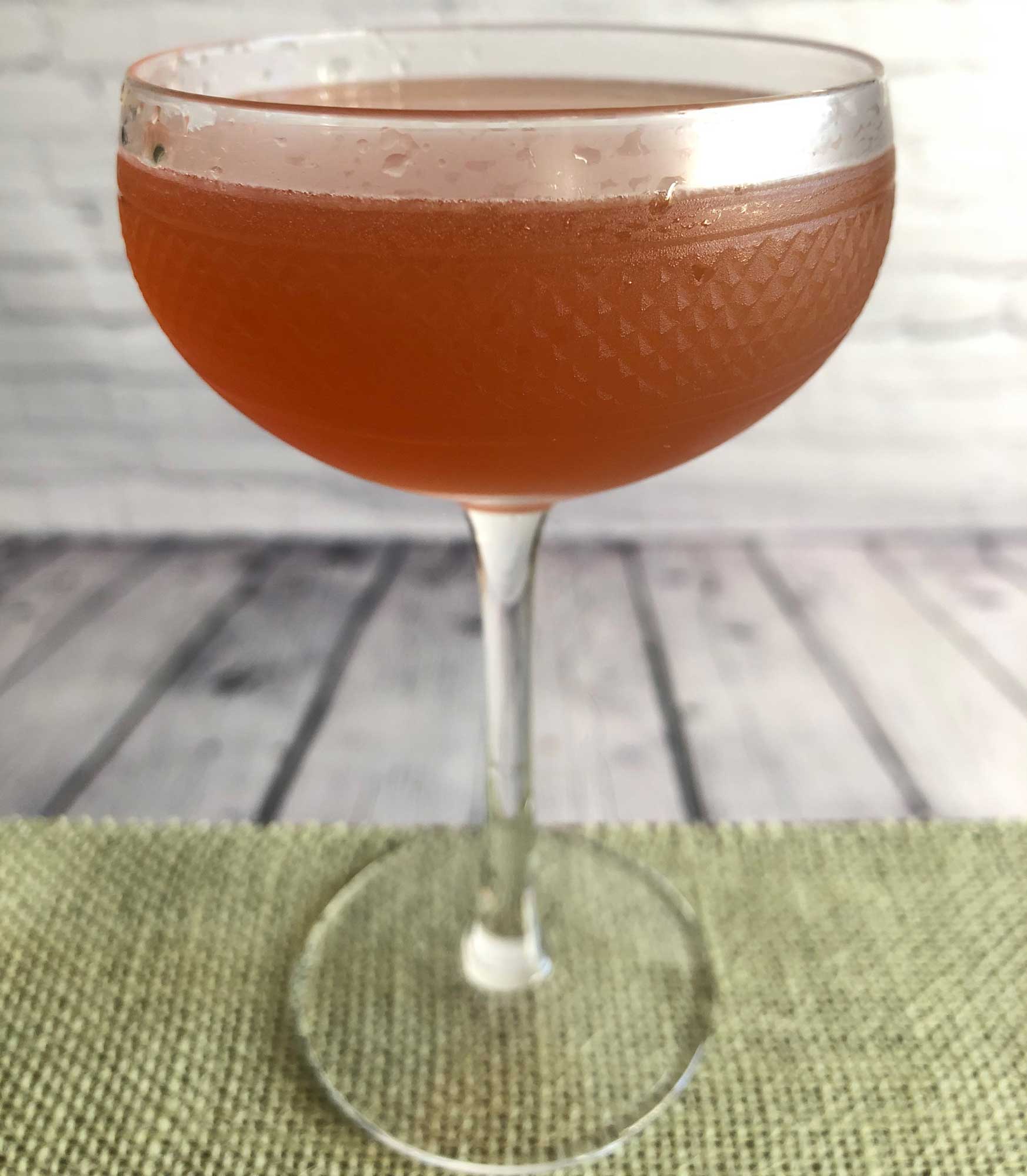 An example of the Post Modern, the mixed drink (cocktail), by Tom Richter, Dear Irving, New York City, featuring scotch whisky, Hayman’s Sloe Gin, lemon juice, honey syrup, and absinthe; photo by Lee Edwards