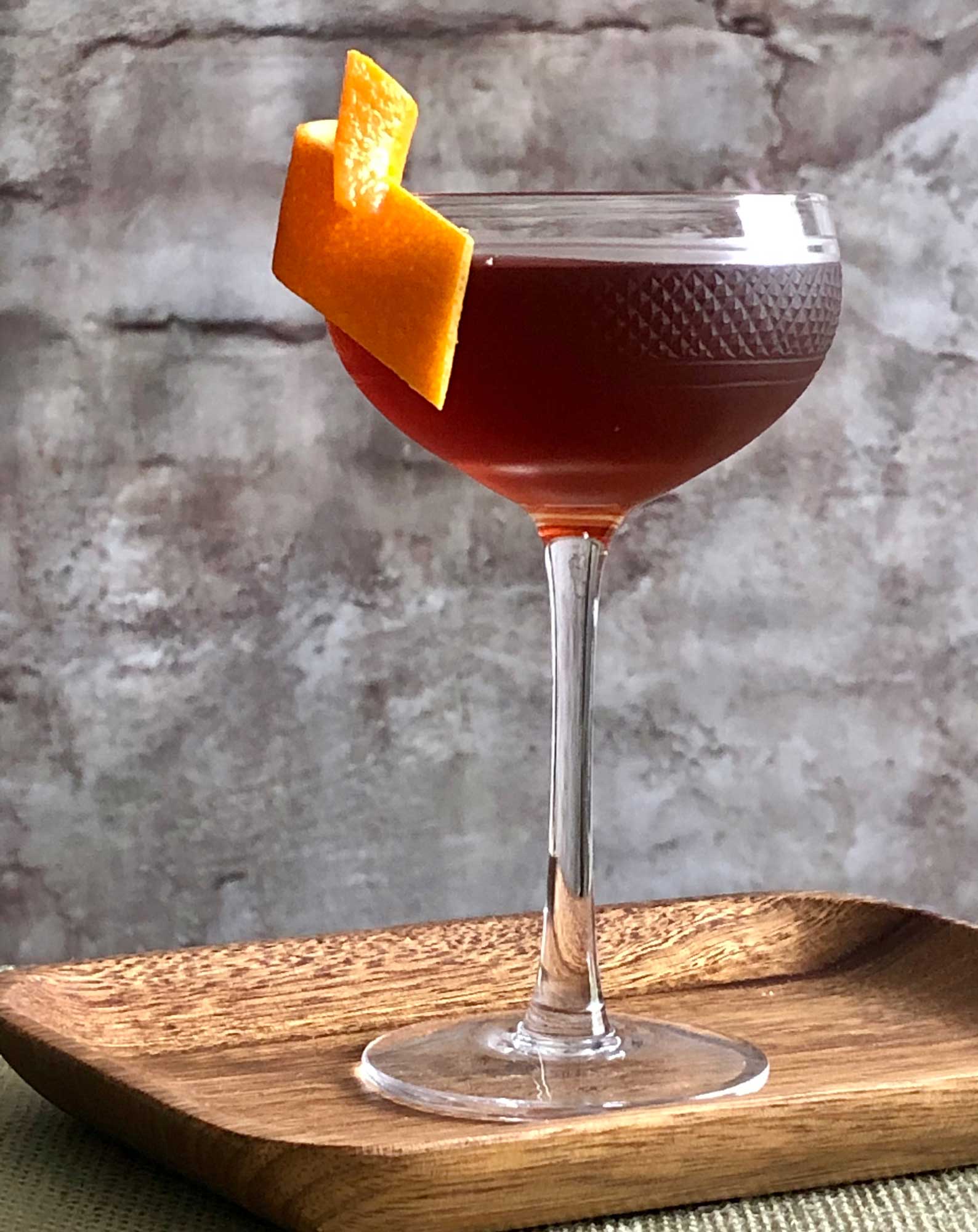 An example of the Stadium of Light, the mixed drink (cocktail) featuring Henriques & Henriques Rainwater Madeira, Dolin Rouge Vermouth de Chambéry, orange bitters, and Angostura bitters; photo by Lee Edwards