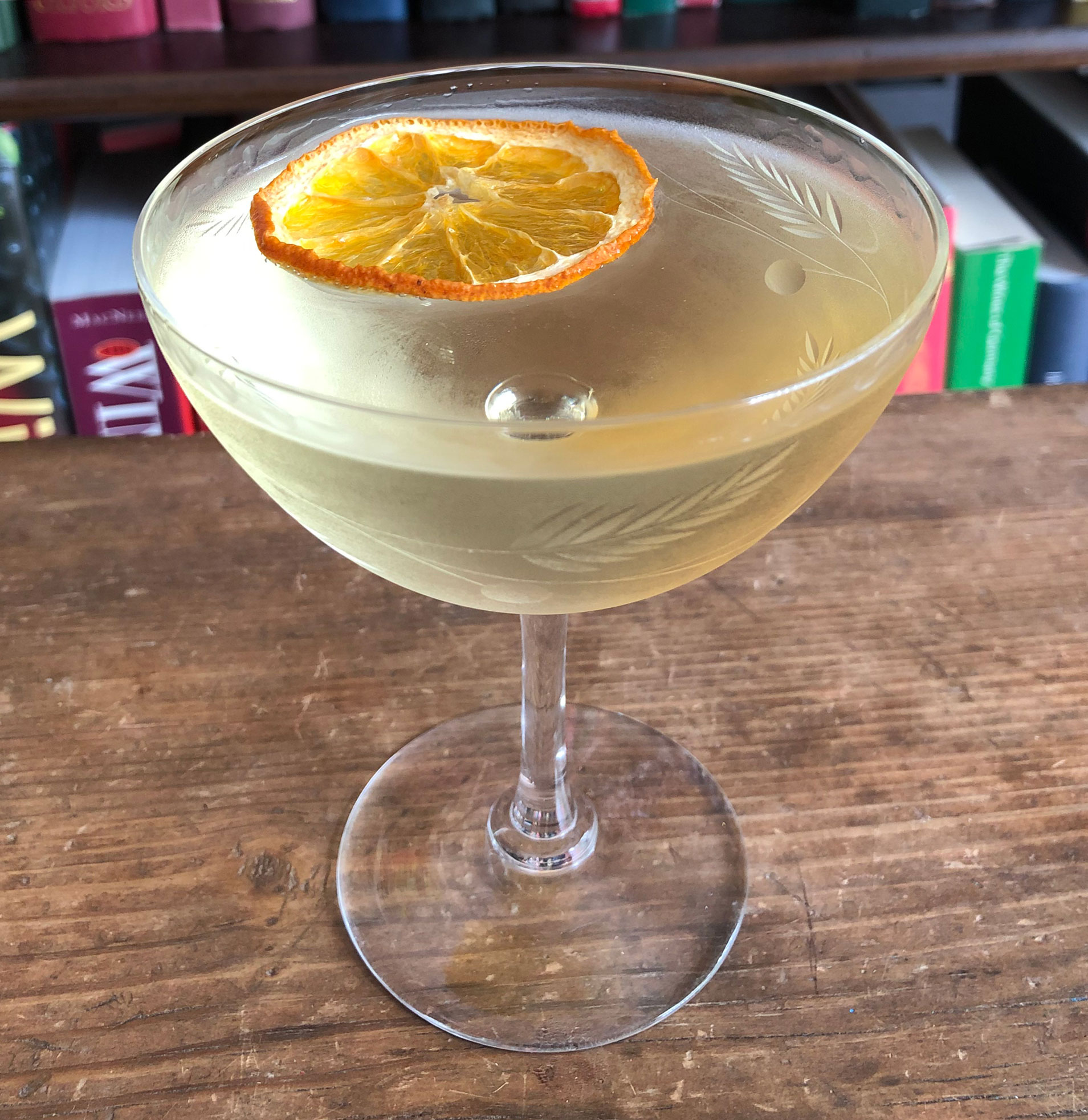 An example of the Ford Cocktail, the mixed drink (cocktail) featuring Hayman’s Old Tom Gin, Dolin Dry Vermouth de Chambéry, Bénédictine, and orange bitters; photo by Lee Edwards