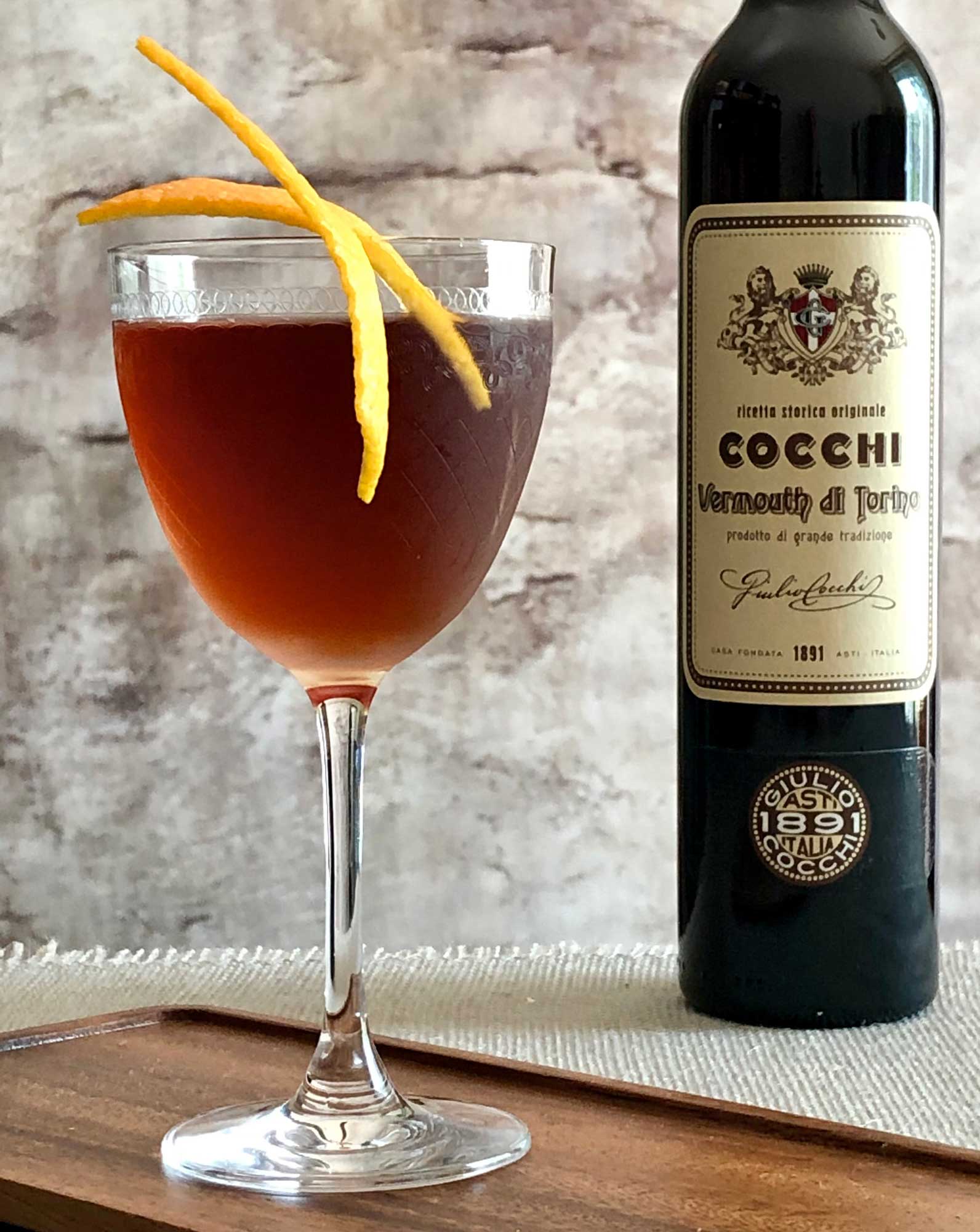 An example of the Martinez de Colón, the mixed drink (cocktail) featuring mezcal, Cocchi Vermouth di Torino ‘Storico’, maraschino liqueur, Angostura bitters, and orange bitters; photo by Lee Edwards