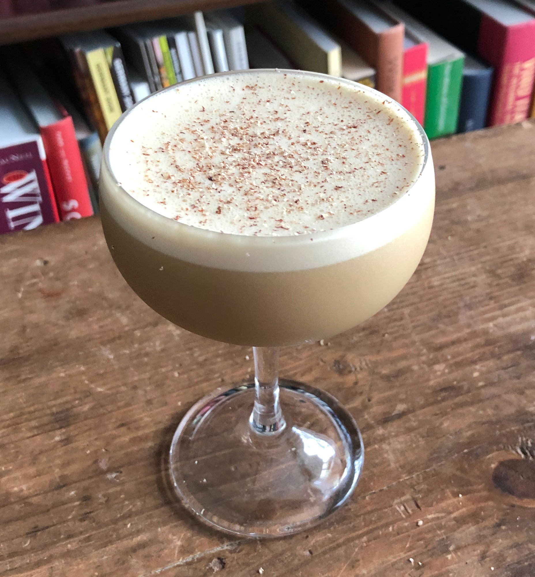 An example of the Alpine Flip, the mixed drink (flip) featuring raw egg, Nux Alpina Walnut Liqueur, The Scarlet Ibis Trinidad Rum, cream, and John D. Taylor’s Velvet Falernum; photo by Lee Edwards