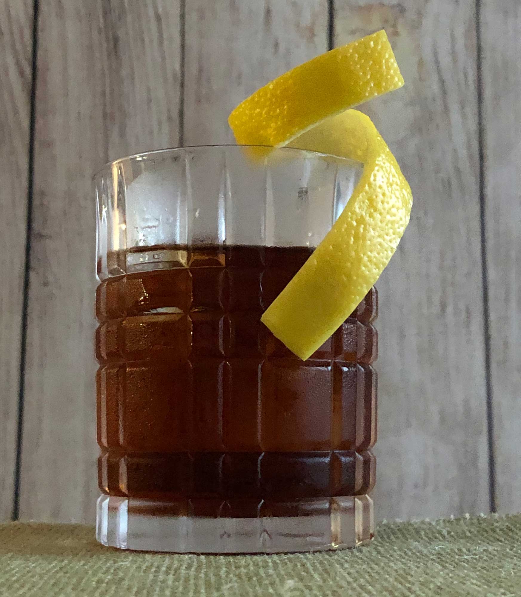 An example of the Juneau, the mixed drink (cocktail) featuring Purkhart Pear Williams Eau-de-Vie, Dolin Génépy le Chamois Liqueur, Nux Alpina Walnut Liqueur, Angostura bitters, and crème de cacao (white); photo by Lee Edwards