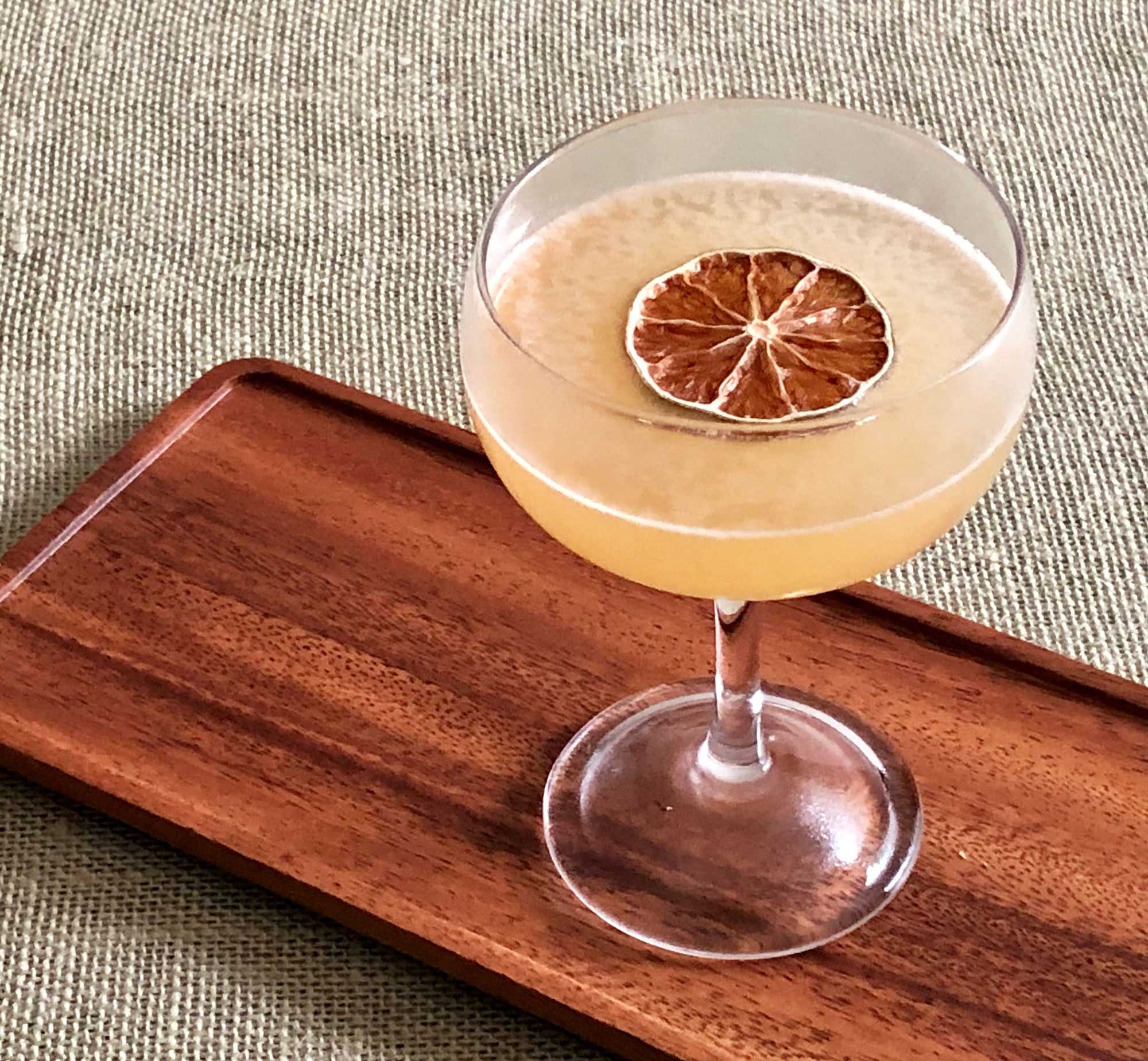 An example of the To The Sun, the mixed drink (cocktail) featuring Smith & Cross Traditional Jamaica Rum, lime juice, Rothman & Winter Orchard Apricot Liqueur, John D. Taylor’s Velvet Falernum, and Angostura bitters; photo by Lee Edwards