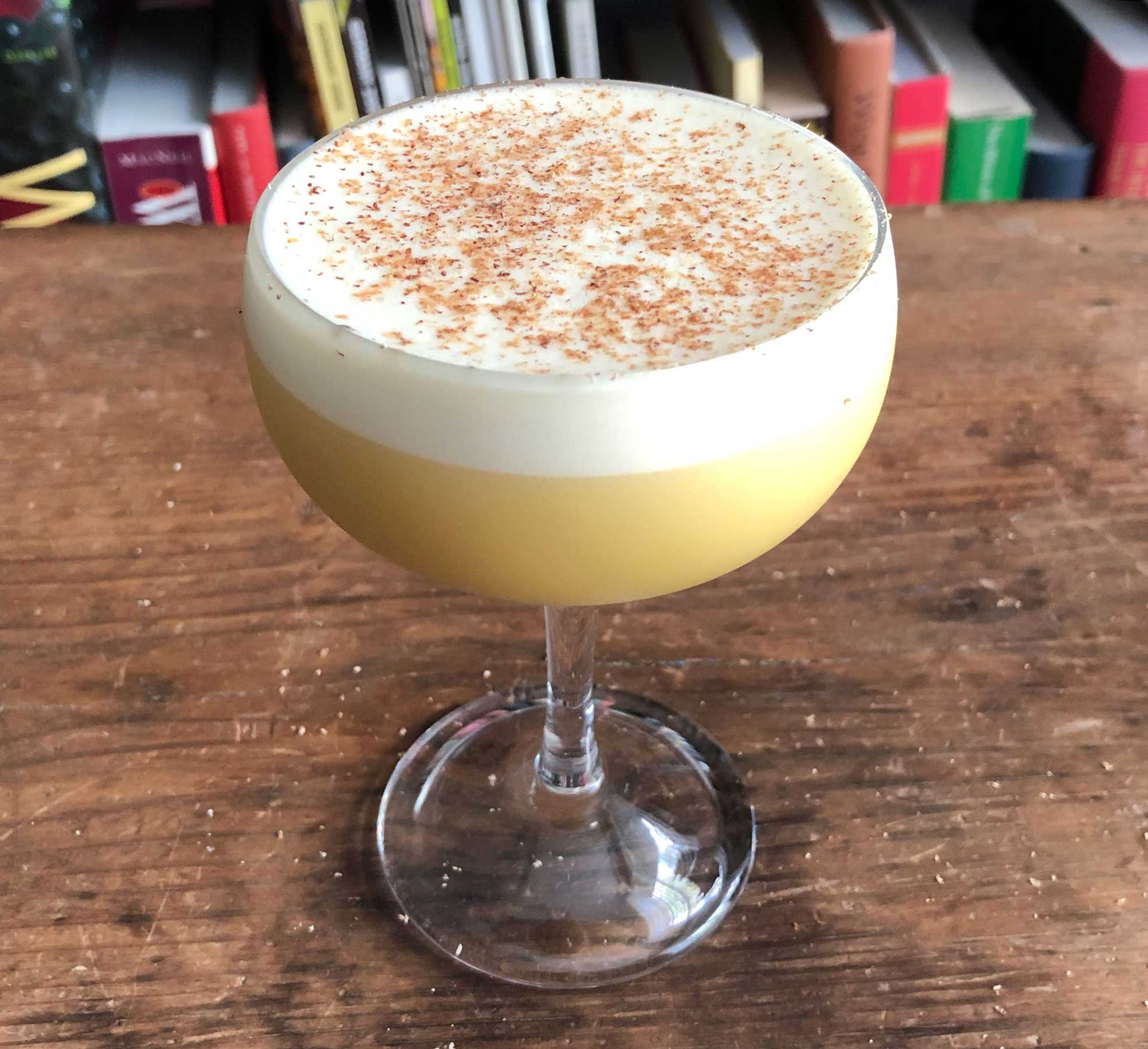 An example of the Apricot Flip, the mixed drink (flip), by John Deragon, PDT, New York City, featuring cognac, raw egg, Rothman & Winter Orchard Apricot Liqueur, and simple syrup; photo by Lee Edwards