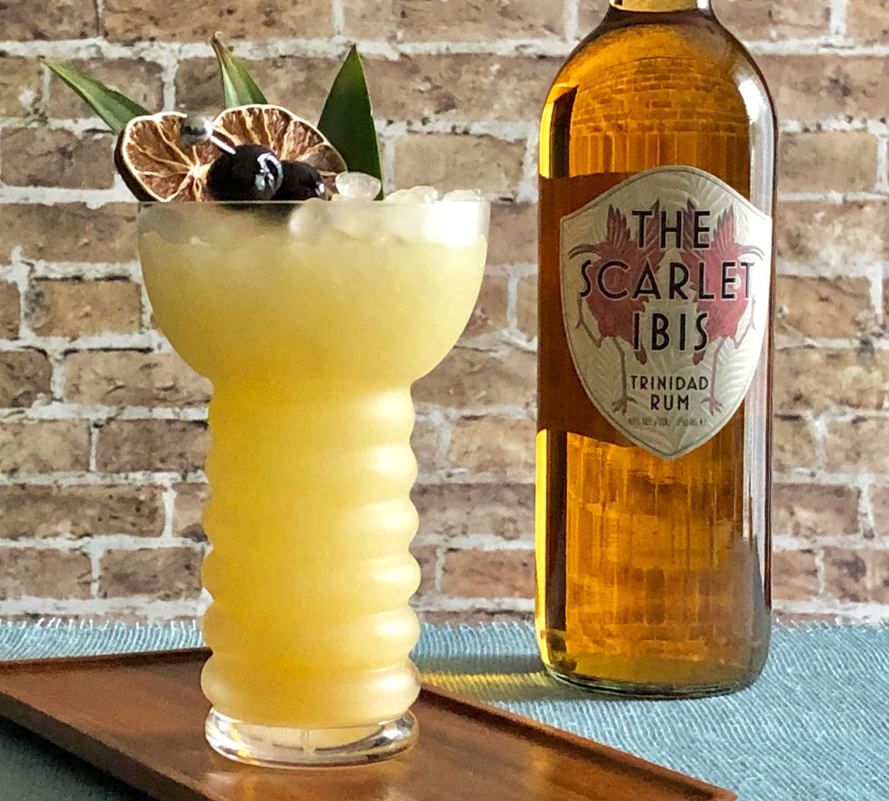 An example of the The Beachbum, the mixed drink (cocktail), by John Deragon, PDT, New York City, featuring The Scarlet Ibis Trinidad Rum, light rum, pineapple juice, lime juice, Rothman & Winter Orchard Apricot Liqueur, and orgeat