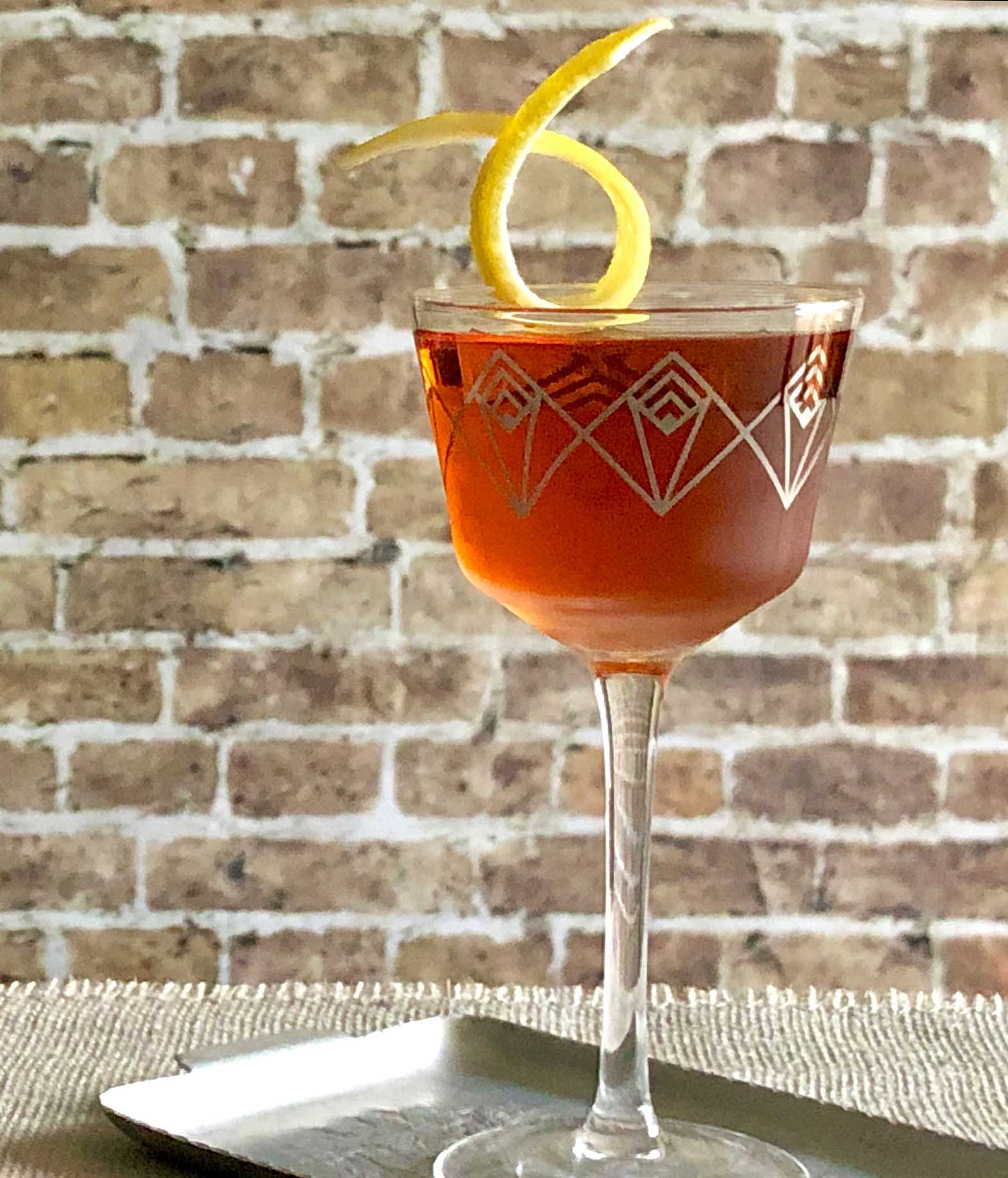 An example of the Southampton, the mixed drink (cocktail), variation of a drink from David Embury, The Fine Art of Mixing Drinks, featuring cognac, Rothman & Winter Orchard Cherry Liqueur, and Angostura bitters; photo by Lee Edwards