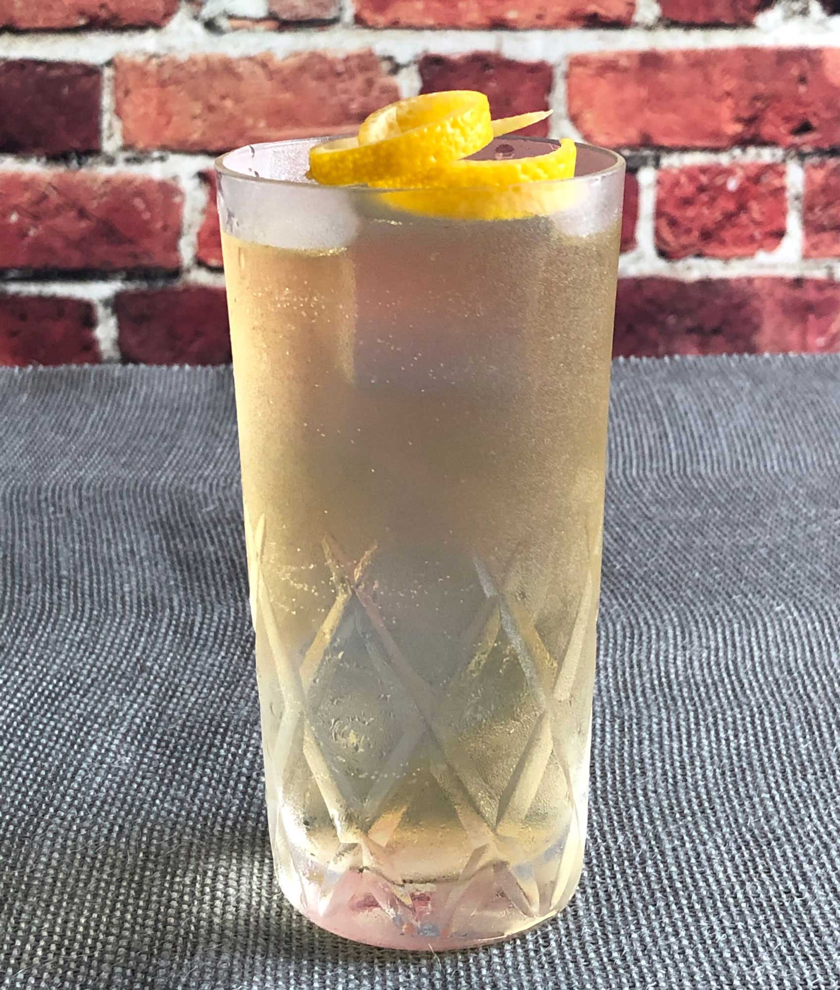 An example of the Auvergne Summer, the mixed drink (cocktail) featuring Rothman & Winter Orchard Peach Liqueur, Salers Gentian Apéritif, and soda water; photo by Lee Edwards