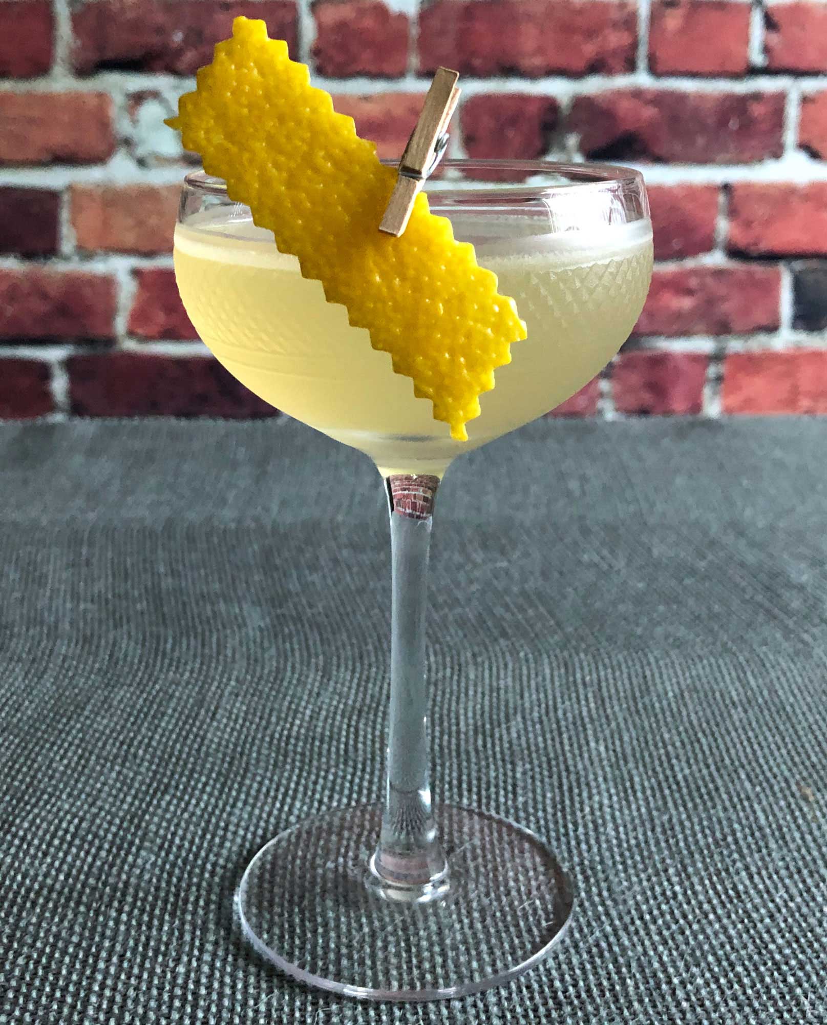 An example of the Her Word, the mixed drink (cocktail) featuring blanco tequila, Rothman & Winter Orchard Peach Liqueur, Cocchi Americano Bianco, and lemon juice; photo by Lee Edwards