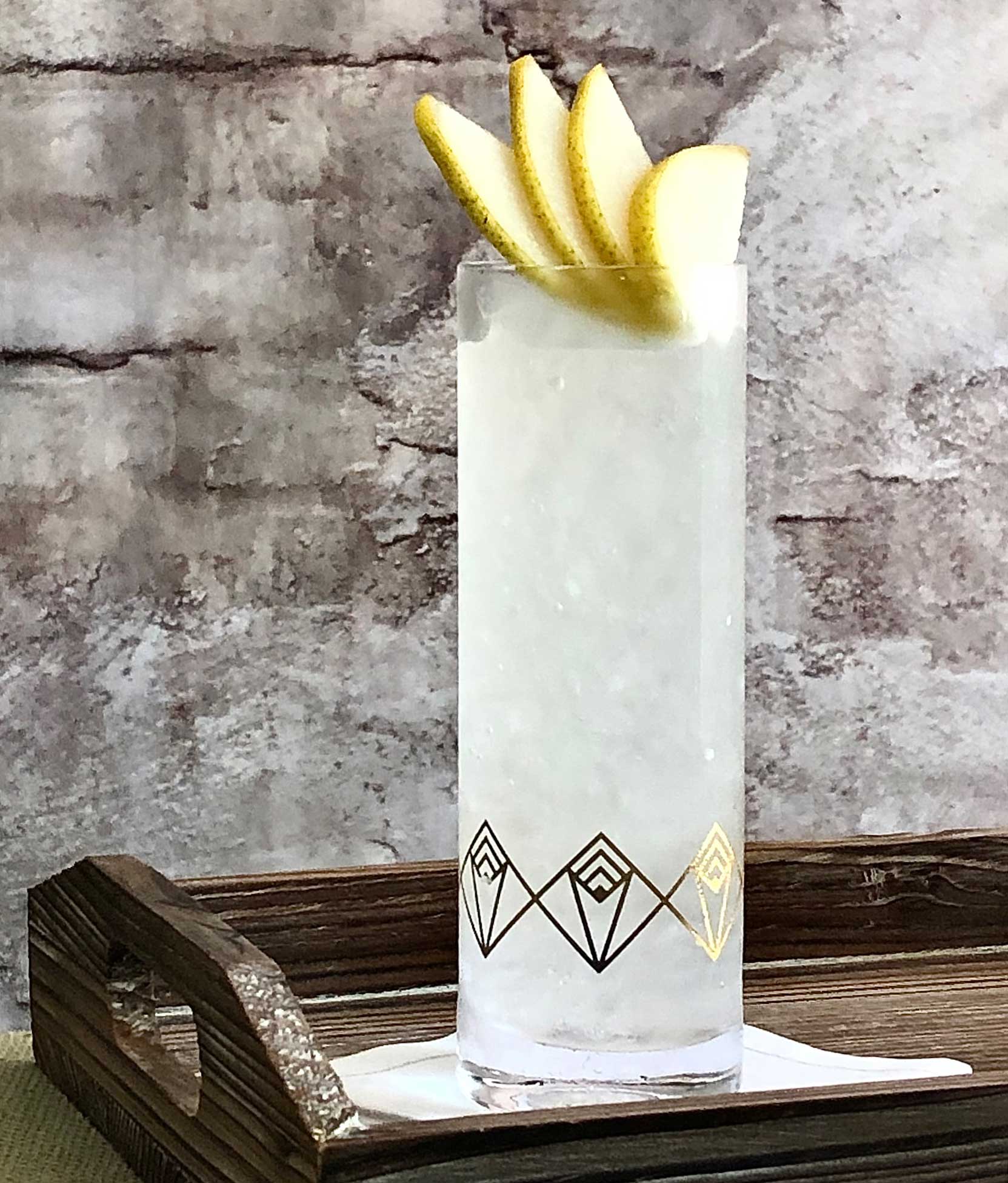 An example of the Bartlett Pear Collins, the mixed drink (collins) featuring soda water, Hayman’s Old Tom Gin, Rothman & Winter Orchard Pear Liqueur, lemon juice, and Purkhart Pear Williams Eau-de-Vie; photo by Lee Edwards