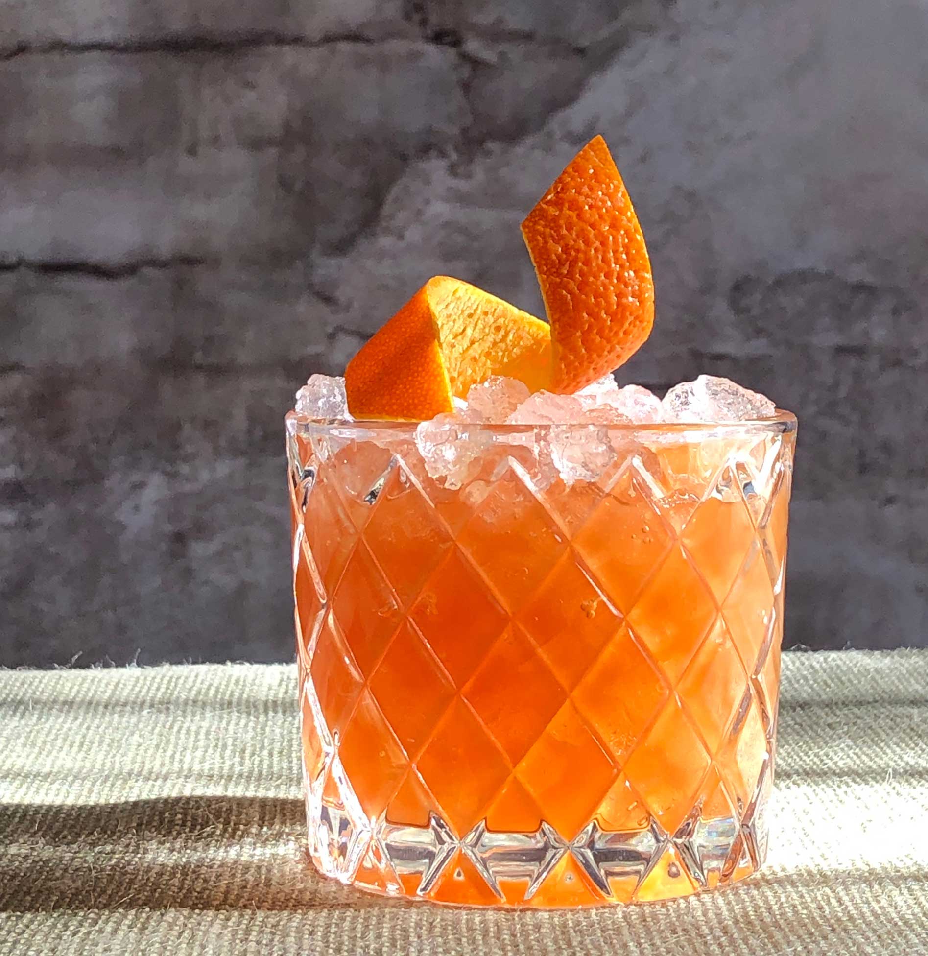An example of the Perfect Storm, the mixed drink (cocktail), by Kellie Thorn, Empire State South, Atlanta, featuring Smith & Cross Traditional Jamaica Rum, passion fruit syrup, Cocchi Vermouth di Torino ‘Storico’, lemon juice, crème de cacao (white), and Angostura bitters; photo by Lee Edwards