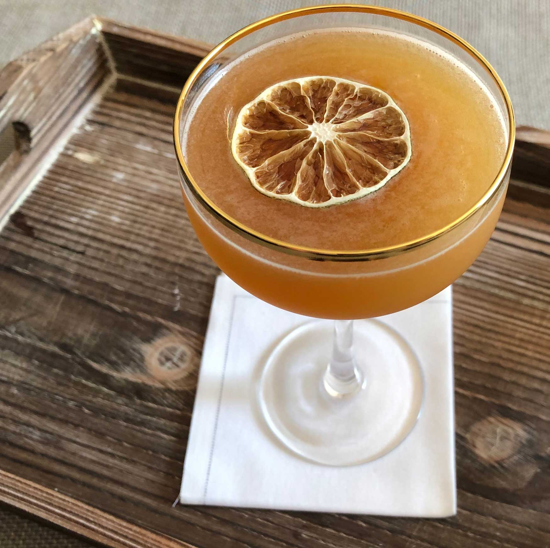 An example of the Navy Cross, the mixed drink (cocktail), by Alexandra Bookless, The Passenger, Washington, DC, featuring Smith & Cross Traditional Jamaica Rum, Cruzan Blackstrap Rum, John D. Taylor’s Velvet Falernum, pineapple juice, lime juice, and St. Elizabeth Allspice Dram; photo by Lee Edwards