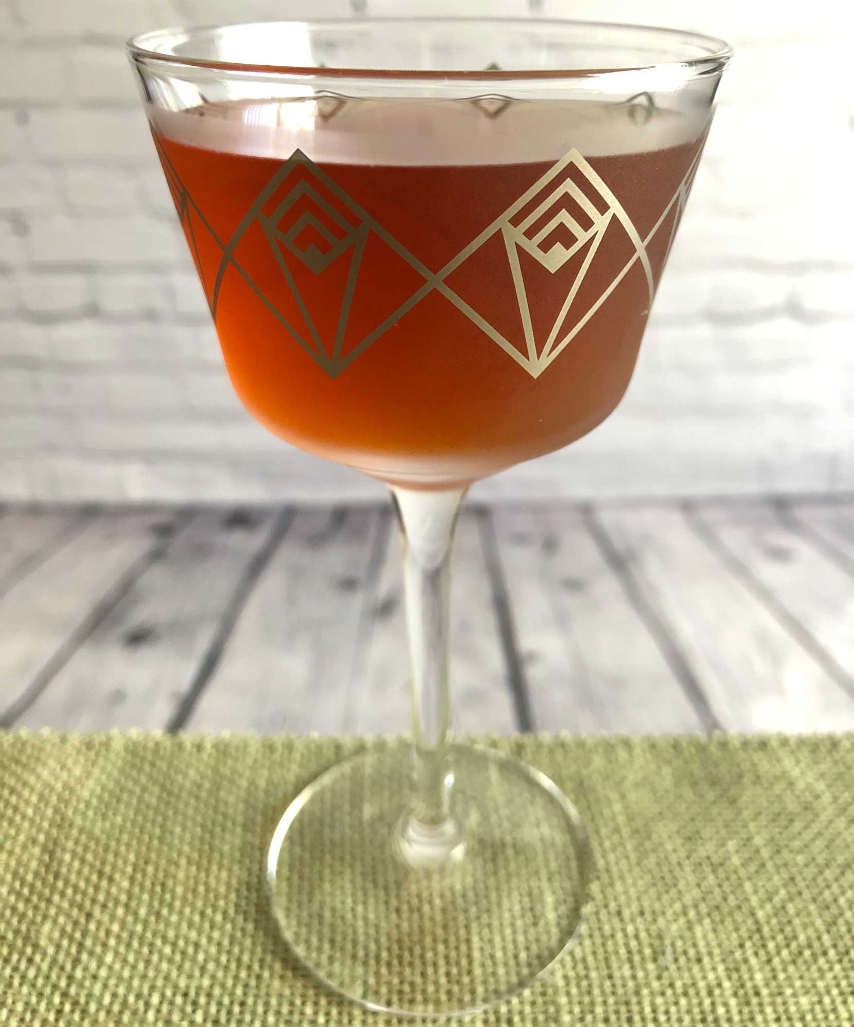 An example of the Careless Whisper, the mixed drink (cocktail), variation from the Whisper, Savoy Cocktail Book, featuring Smith & Cross Traditional Jamaica Rum, Cocchi Vermouth di Torino ‘Storico’, Dolin Dry Vermouth de Chambéry, orange bitters, and Angostura bitters; photo by Lee Edwards