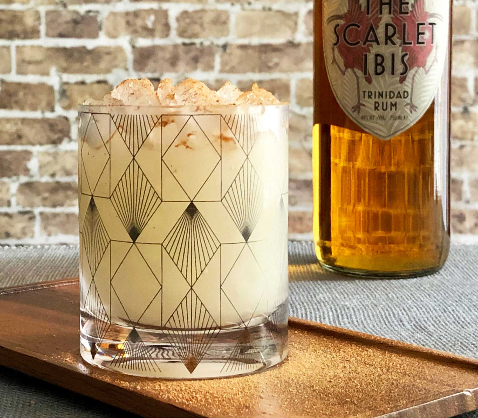 An example of the Reverse Sweep, the mixed drink (cocktail) featuring The Scarlet Ibis Trinidad Rum, irish whiskey, lemon juice, and orgeat; photo by Lee Edwards
