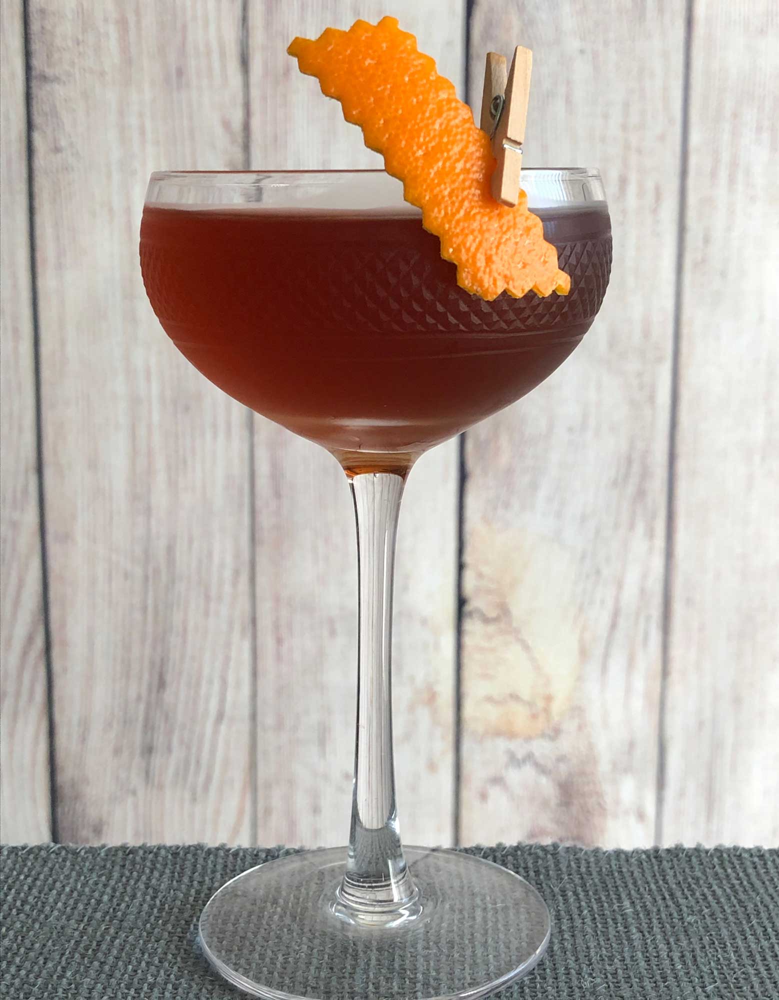 An example of the Palmetto no. 2, the mixed drink (cocktail) featuring The Scarlet Ibis Trinidad Rum, Dolin Rouge Vermouth de Chambéry, orange bitters, and Angostura bitters; photo by Lee Edwards