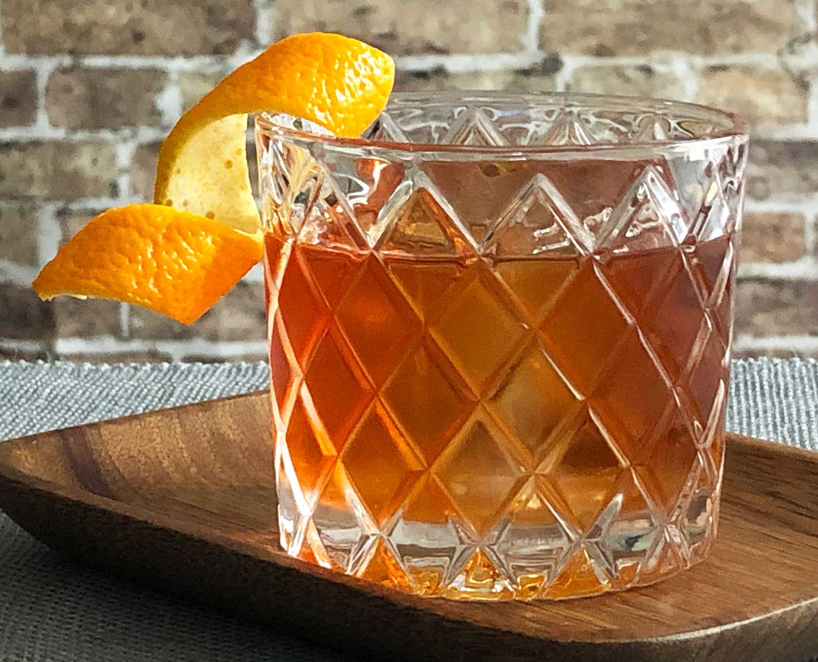 An example of the Rum Old Fashioned, the mixed drink (cocktail) featuring The Scarlet Ibis Trinidad Rum, Smith & Cross Traditional Jamaica Rum, rich demerara syrup, and Angostura bitters; photo by Lee Edwards