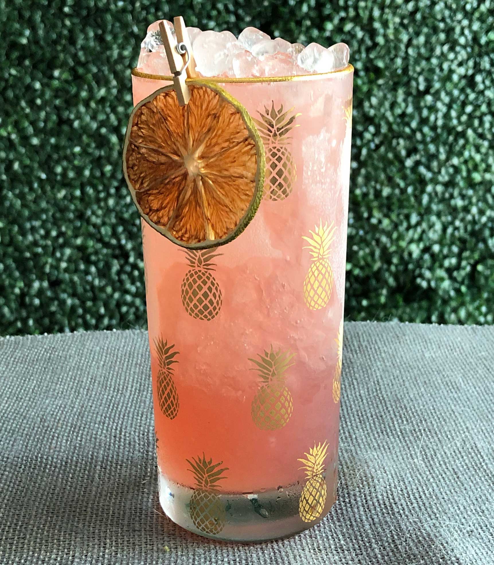 An example of the Zirbenz Swizzle, the mixed drink (frappe), by based on a drink by Jamie Boudreau, Canon, Seattle, Washington, featuring Hayman’s Old Tom Gin, Zirbenz Stone Pine Liqueur of the Alps, Dolin Génépy le Chamois Liqueur, lime juice, and simple syrup; photo by Lee Edwards