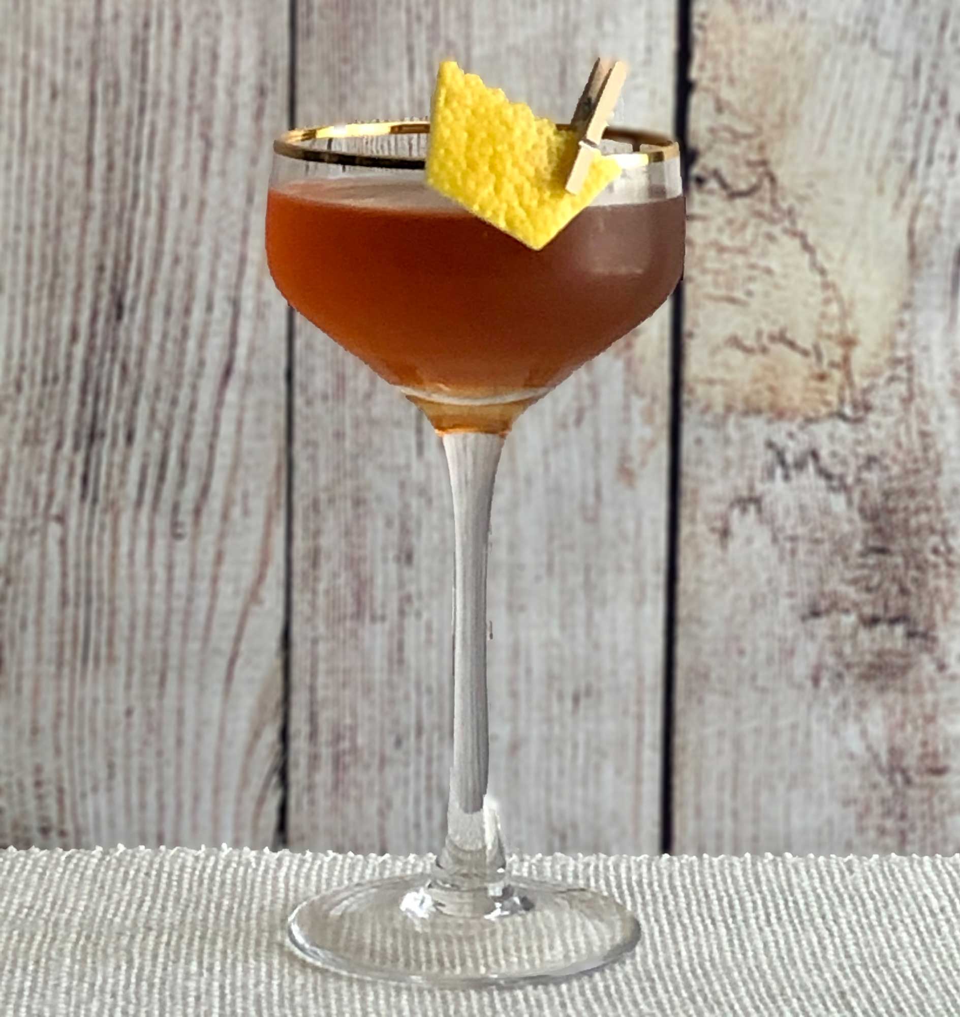An example of the Return of the King, the mixed drink (cocktail), by John Filby, Augustine, NYC, featuring blended grain scotch or bourbon whiskey, Pasubio Vino Amaro, and Carpano Punt e Mes; photo by Lee Edwards
