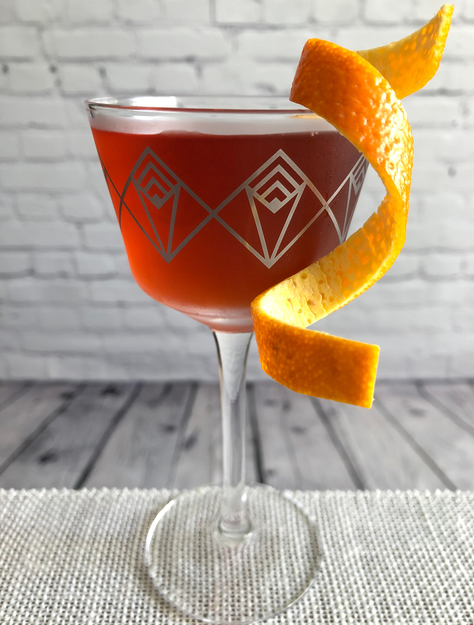An example of the The Italian Job, the mixed drink (cocktail), by Joseph Akhavan, Mabel, Paris, featuring Smith & Cross Traditional Jamaica Rum, Cocchi Americano Bianco, Aperitivo Cappelletti, Byrrh Grand Quinquina, and orange bitters; photo by Lee Edwards