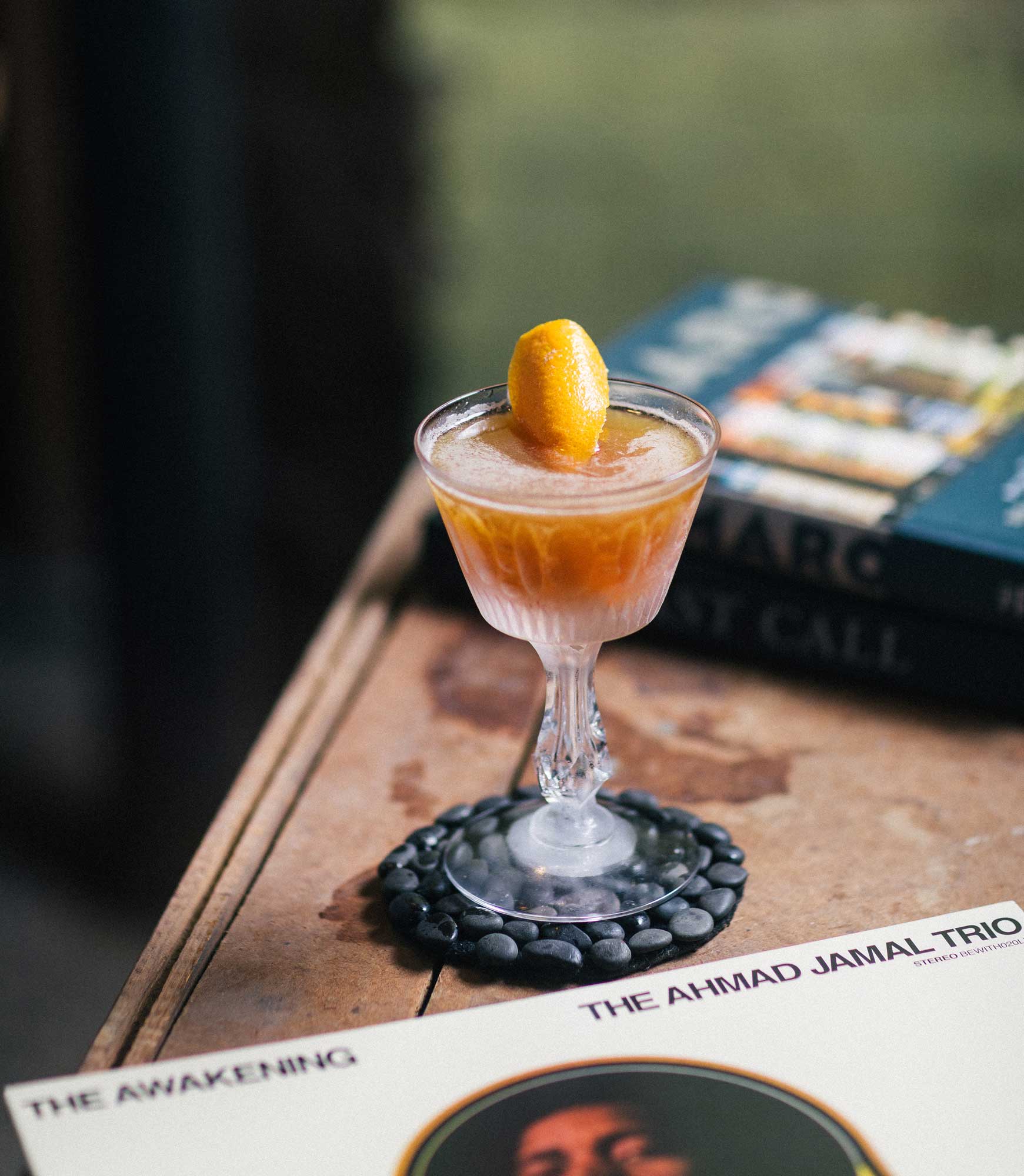 An example of the Lush Interlude, the mixed drink (cocktail), by Braden LaGrone, Cure, New Orleans, featuring Amaro Sfumato Rabarbaro, brown rum, lime juice, cognac or orange-flavored liqueur, and rich demerara syrup; photo by S. Kallstrand