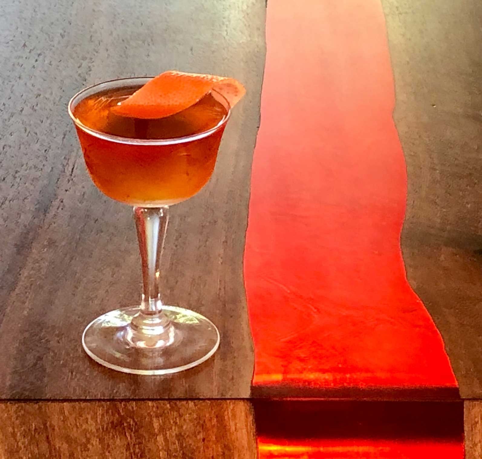 An example of the Rum al Pastor, the mixed drink (cocktail) featuring Plantation Pineapple Original Dark Rum, Amaro Sfumato Rabarbaro, and orange bitters; photo by Lee Edwards
