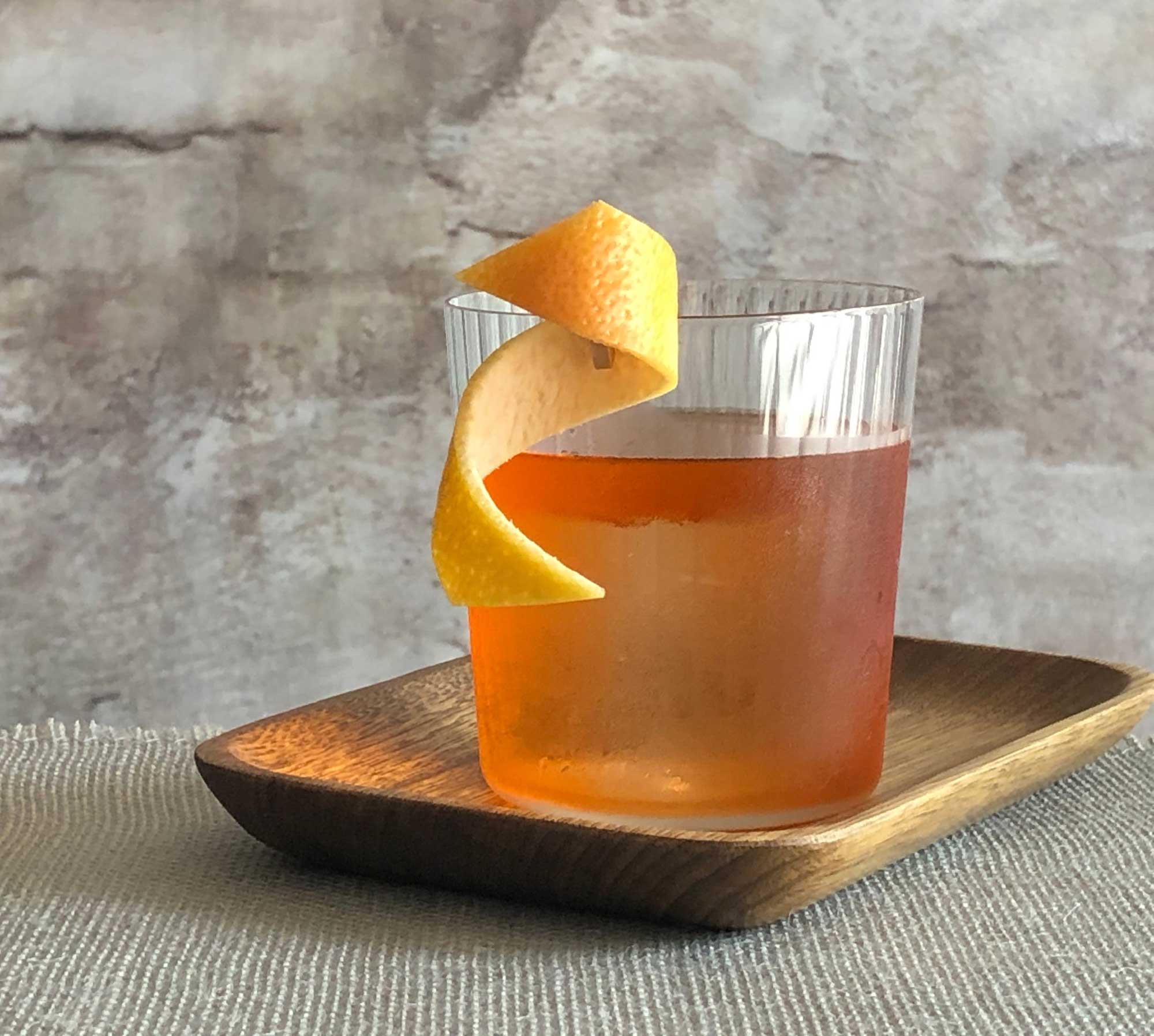 An example of the Death Or Glory, the mixed drink (cocktail), by Abigail Gullo, Compere Lapin, NOLA, featuring mezcal, Aperitivo Cappelletti, Mattei Cap Corse Blanc Quinquina, and Bittermens Orange Cream Citrate; photo by Lee Edwards
