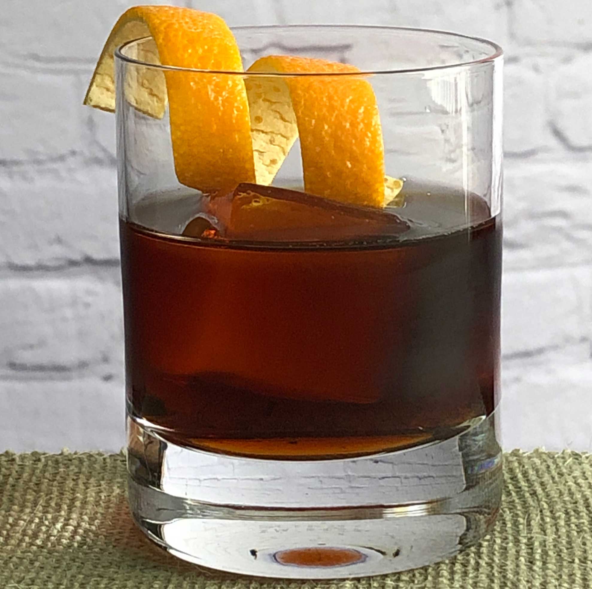An example of the Amaricanto, the mixed drink (cocktail) featuring Cocchi Vermouth di Torino ‘Storico’, Elisir Novasalus, and orange bitters; photo by Lee Edwards