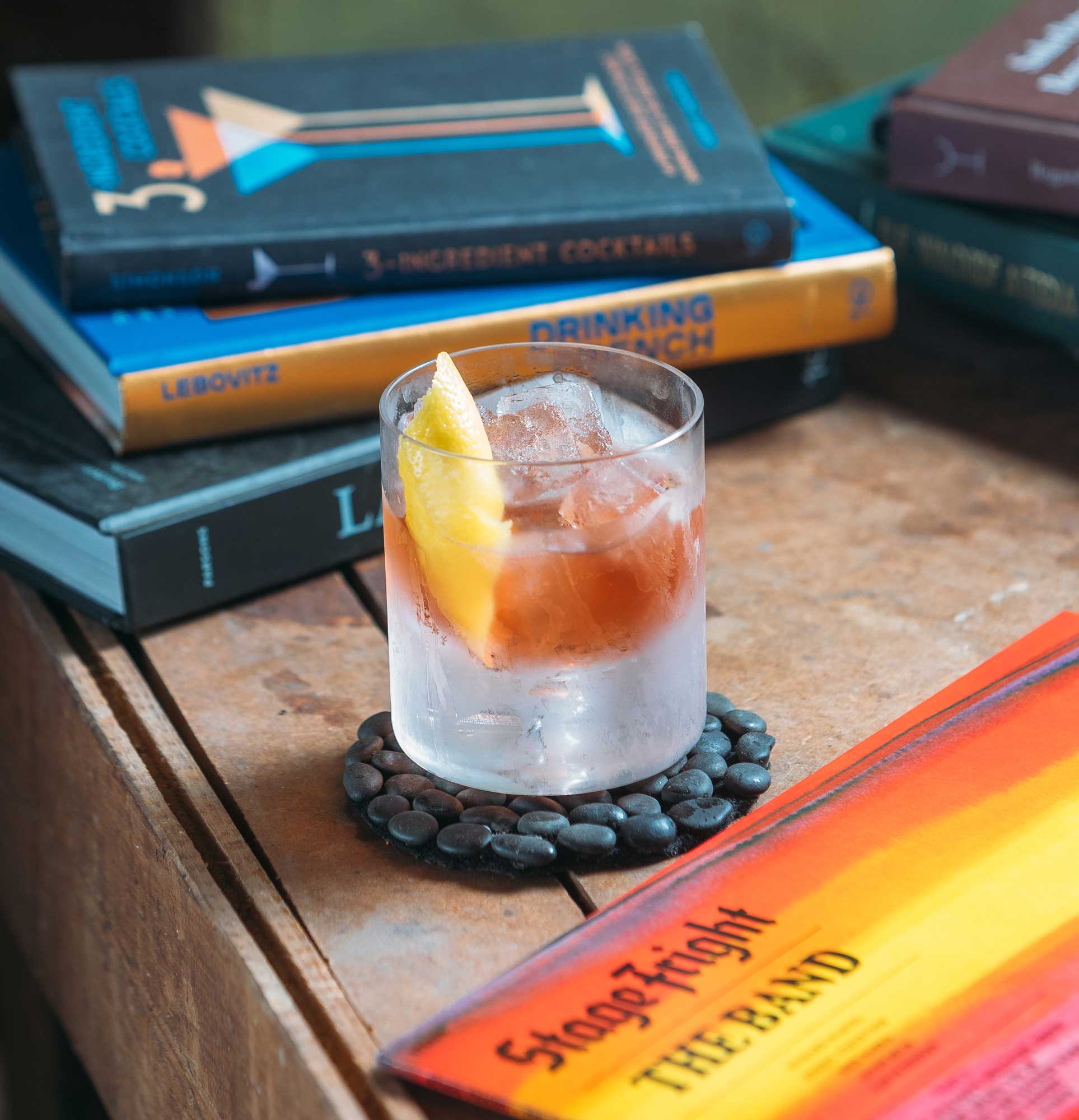 An example of the Violet Negroni, the mixed drink (cocktail) featuring Hayman’s London Dry Gin, Byrrh Grand Quinquina, and Salers Gentian Apéritif; photo by S. Kallstrand