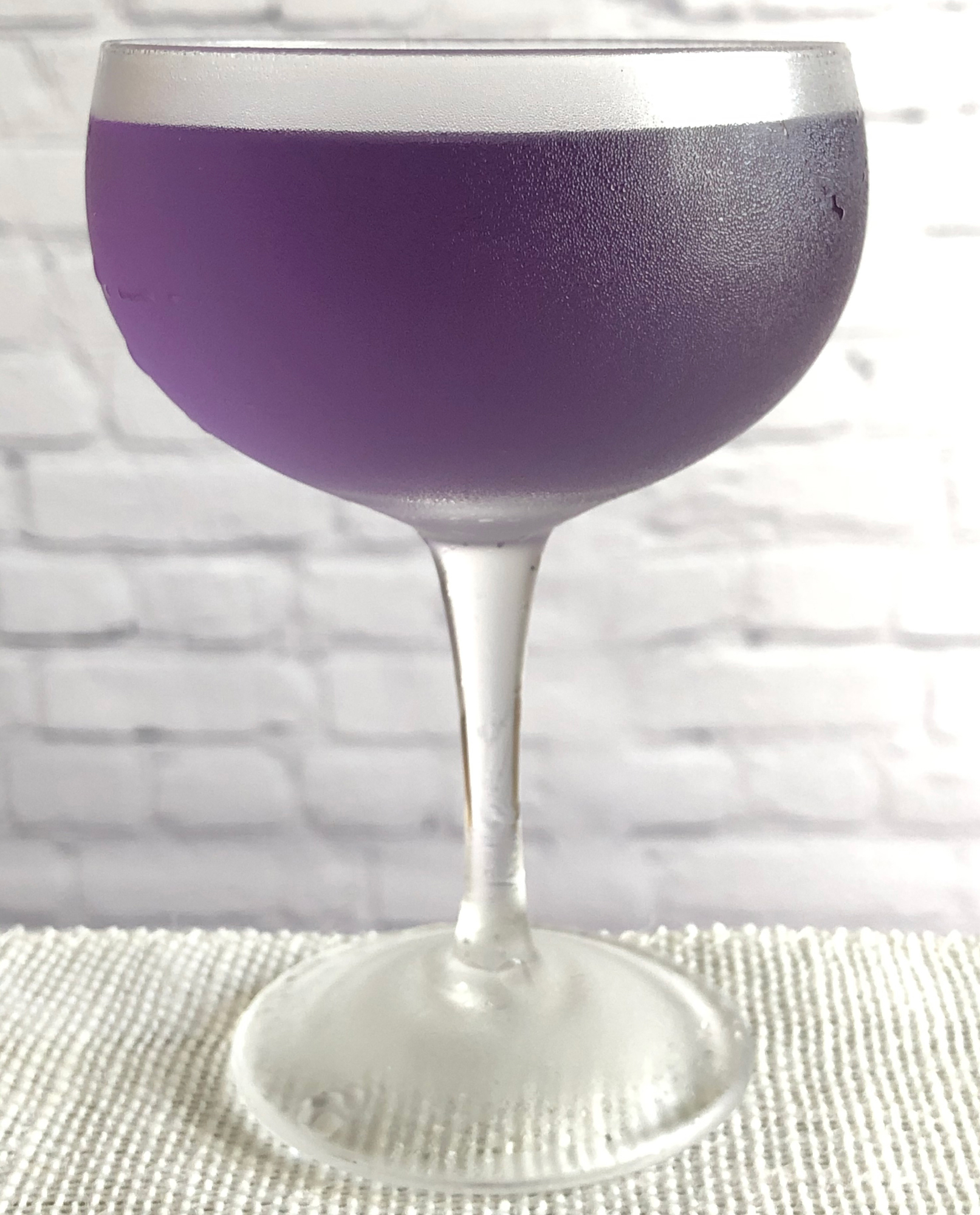 An example of the Yale Cocktail, the mixed drink (cocktail), by Eric Felten, Wall Street Journal, featuring Hayman’s London Dry Gin, Rothman & Winter Crème de Violette, Dolin Dry Vermouth de Chambéry, and Angostura bitters; photo by Lee Edwards
