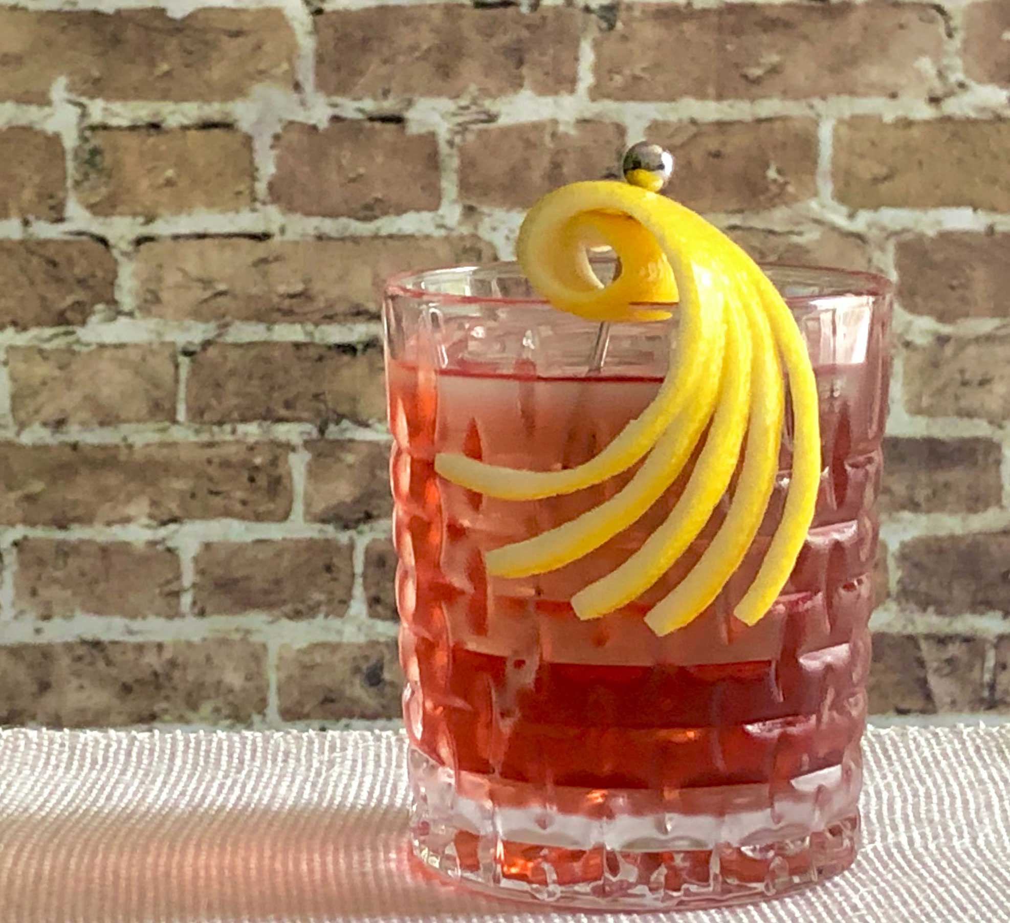 An example of the Hidden Roots, the mixed drink (cocktail) featuring bourbon whiskey, and Cocchi Americano Rosa; photo by Lee Edwards