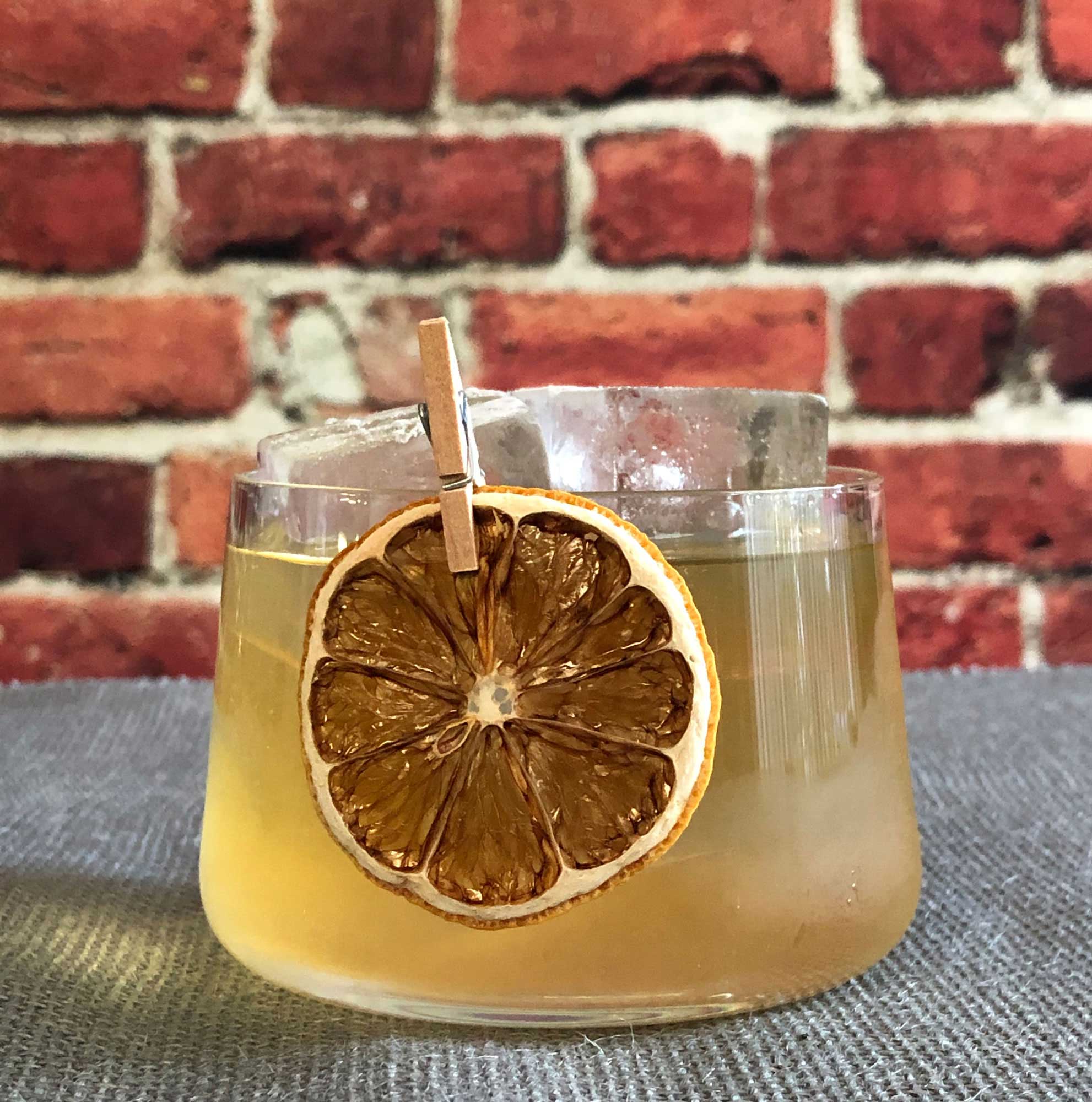 An example of the July on Royal Street, the mixed drink (cocktail) featuring Mattei Cap Corse Blanc Quinquina, Salers Gentian Apéritif, reposado tequila, Bénédictine, and lemon juice; photo by Lee Edwards