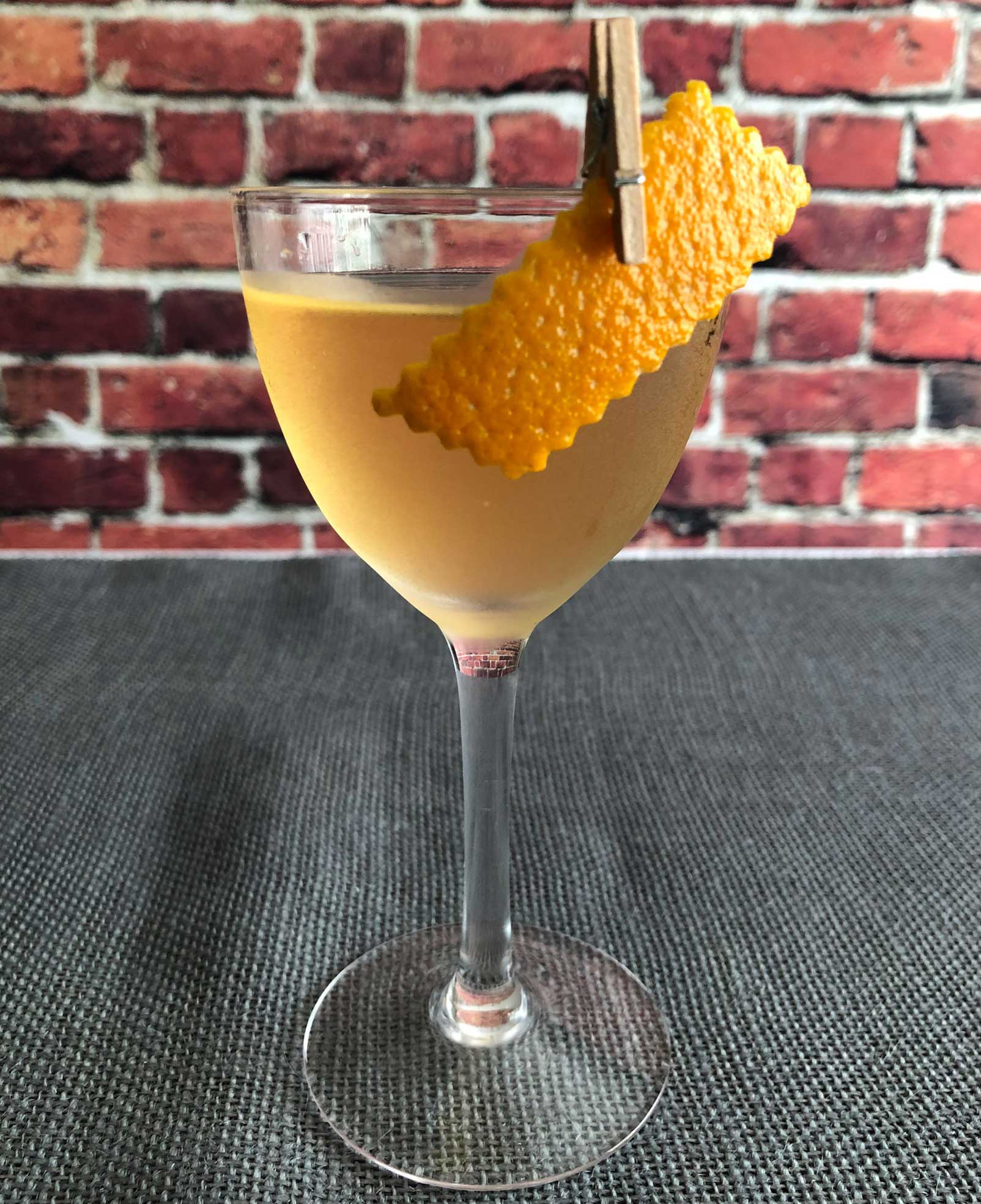 An example of the Rebirth of the Cool, the mixed drink (cocktail) featuring Mattei Cap Corse Blanc Quinquina, Purkhart Pear Williams Eau-de-Vie, and orange bitters; photo by Lee Edwards