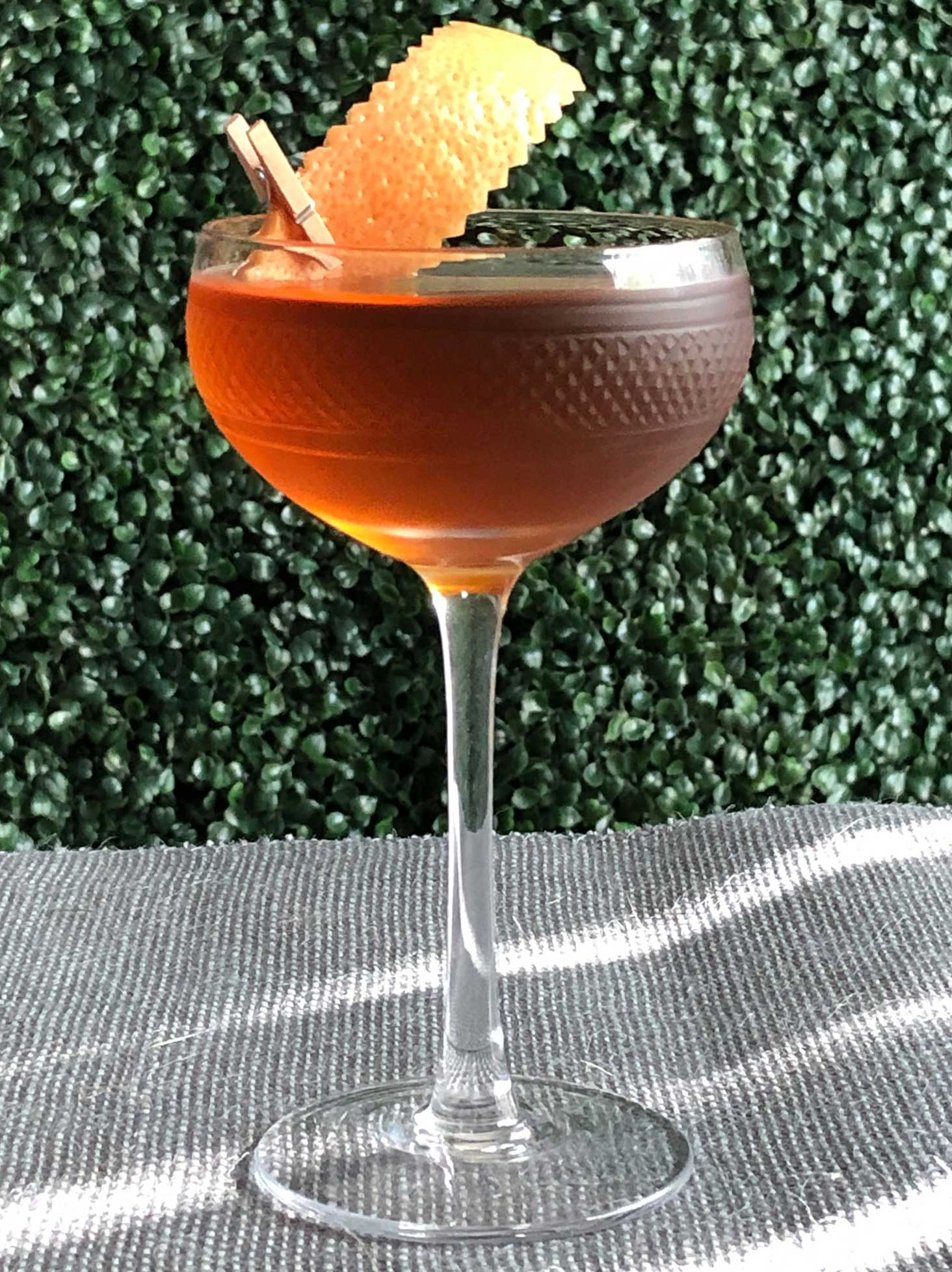 An example of the Diamond in the Rough, the mixed drink (cocktail) featuring Hayman’s Old Tom Gin, Bonal Gentiane-Quina, Amaro Alta Verde, and orange bitters; photo by Lee Edwards