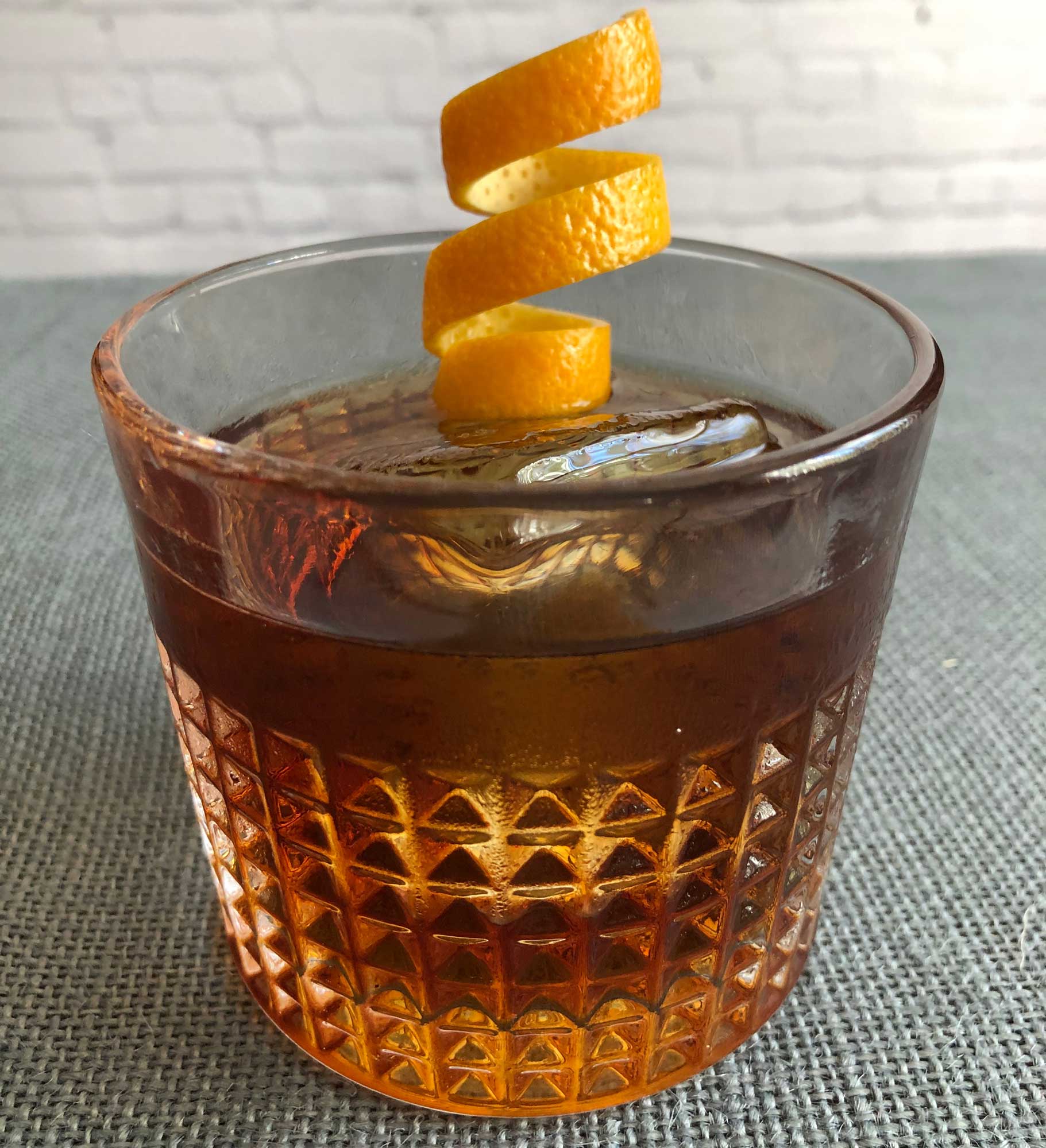 An example of the Fire on the Mountain, the mixed drink (cocktail) featuring Bonal Gentiane-Quina, single-malt scotch, and orange bitters; photo by Lee Edwards