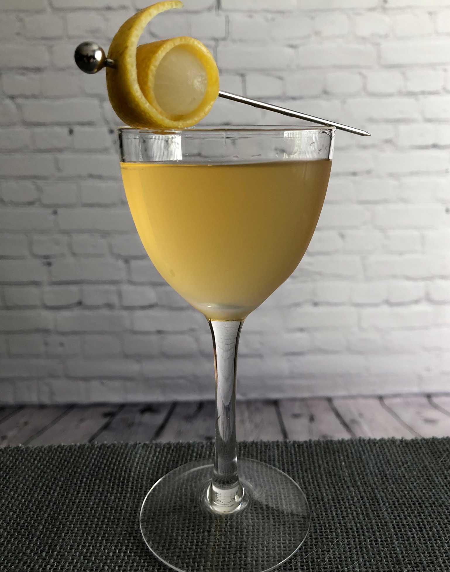 An example of the Sisters and Brothers, the mixed drink (cocktail), by Kate Perry, Seattle, featuring clairin or rhum agricole blanc, Mattei Cap Corse Blanc Quinquina, and orange bitters; photo by Lee Edwards