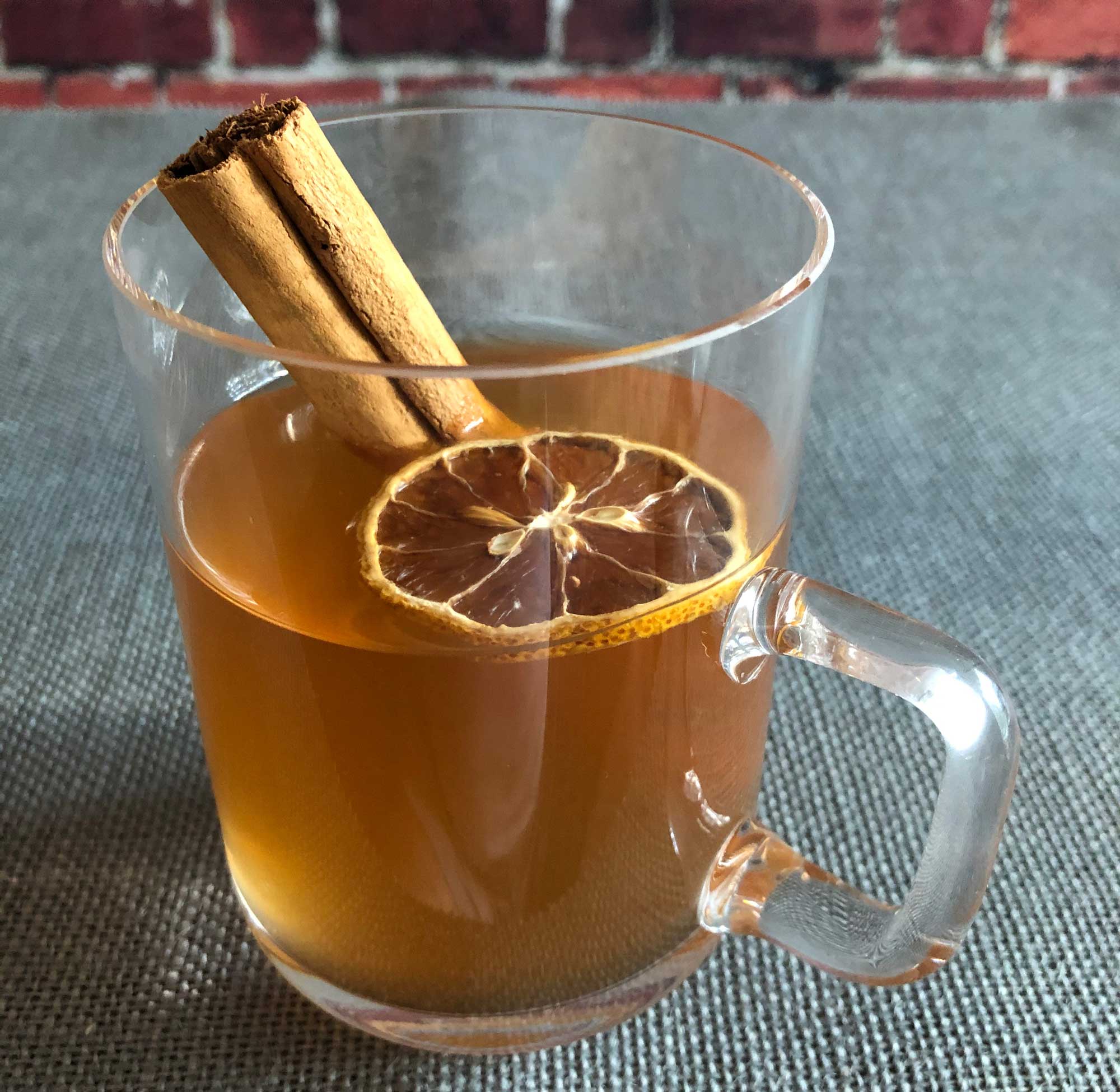 An example of the Flurries on East Bay Street, the mixed drink (cocktail) featuring hot water, Henriques & Henriques Generoso Doce 5 Year Old Madeira, bourbon whiskey, and lemon juice; photo by Lee Edwards