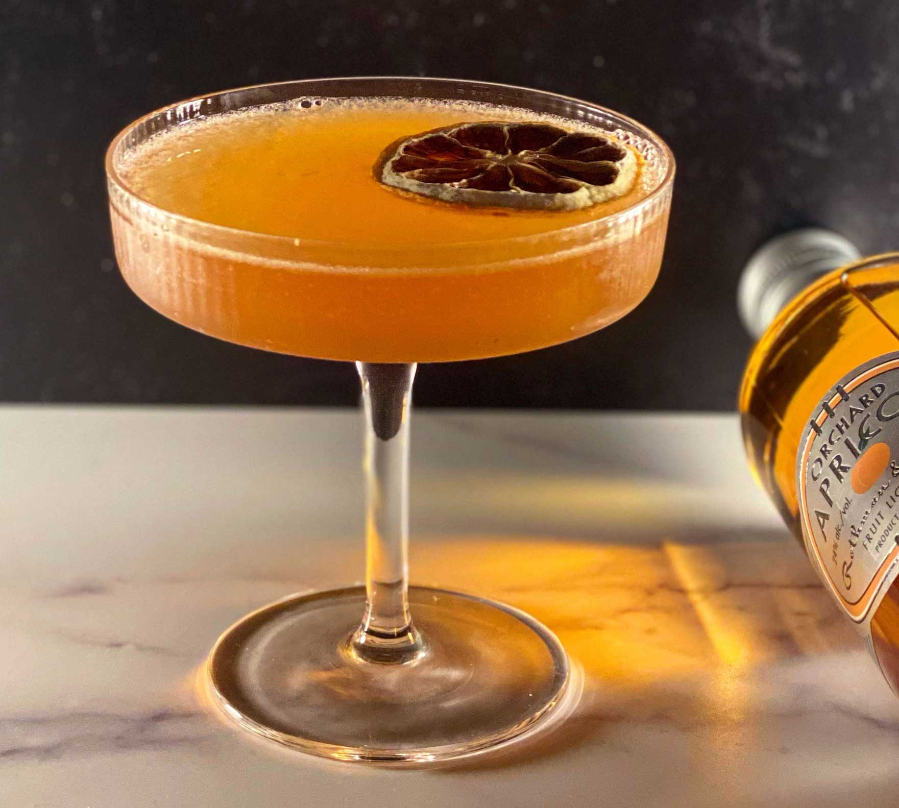 An example of the Flor de Jerez, the mixed drink (cocktail), by Joaquìn Simò, NYC, featuring amontillado, lemon juice, Smith & Cross Traditional Jamaica Rum, rich simple syrup, Rothman & Winter Orchard Apricot Liqueur, and Angostura bitters; photo by @slightlygarnished