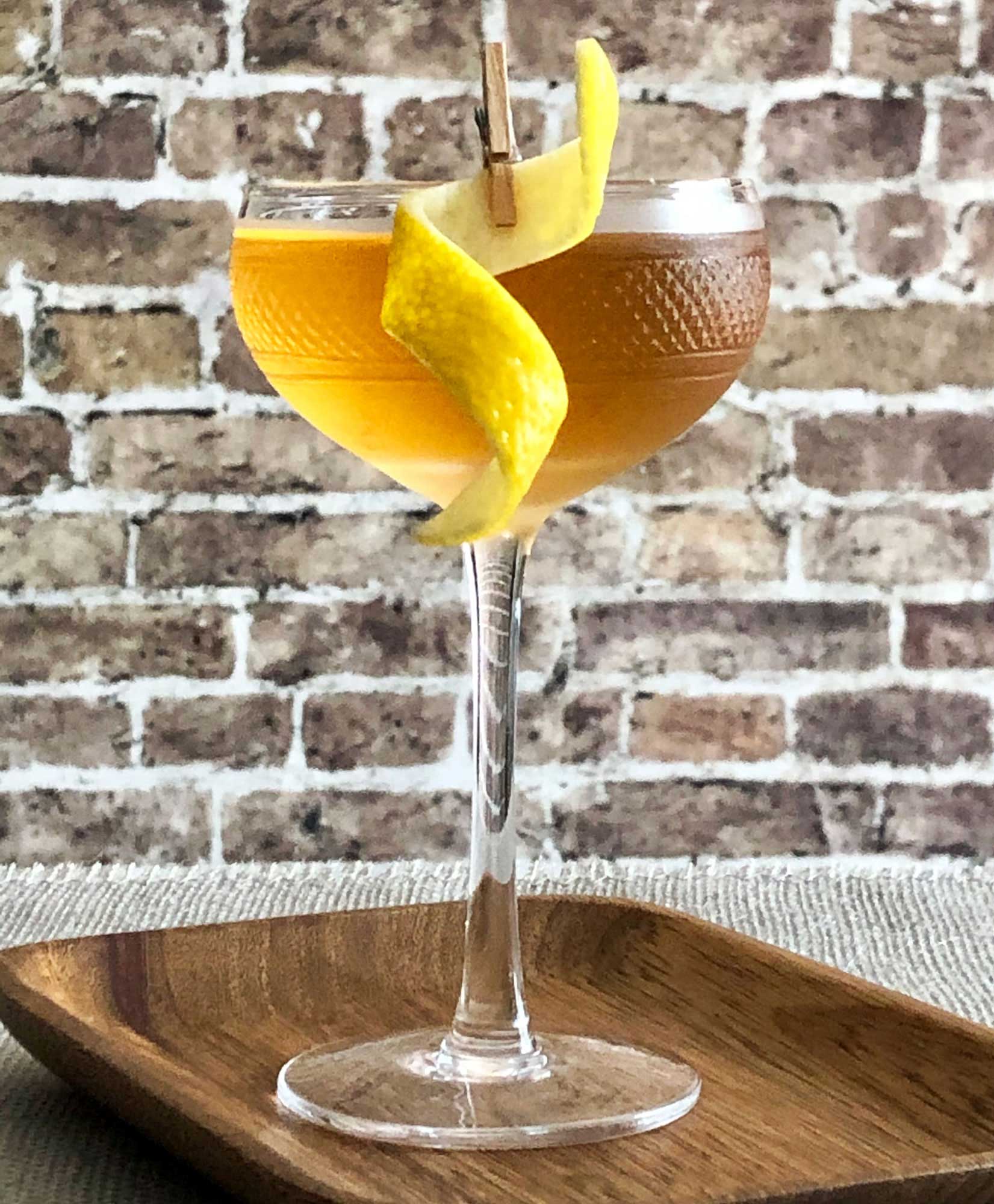 An example of the Empire, the mixed drink (cocktail), by Savoy Cocktail Book, featuring Hayman’s London Dry Gin, calvados, and Rothman & Winter Orchard Apricot Liqueur; photo by Lee Edwards