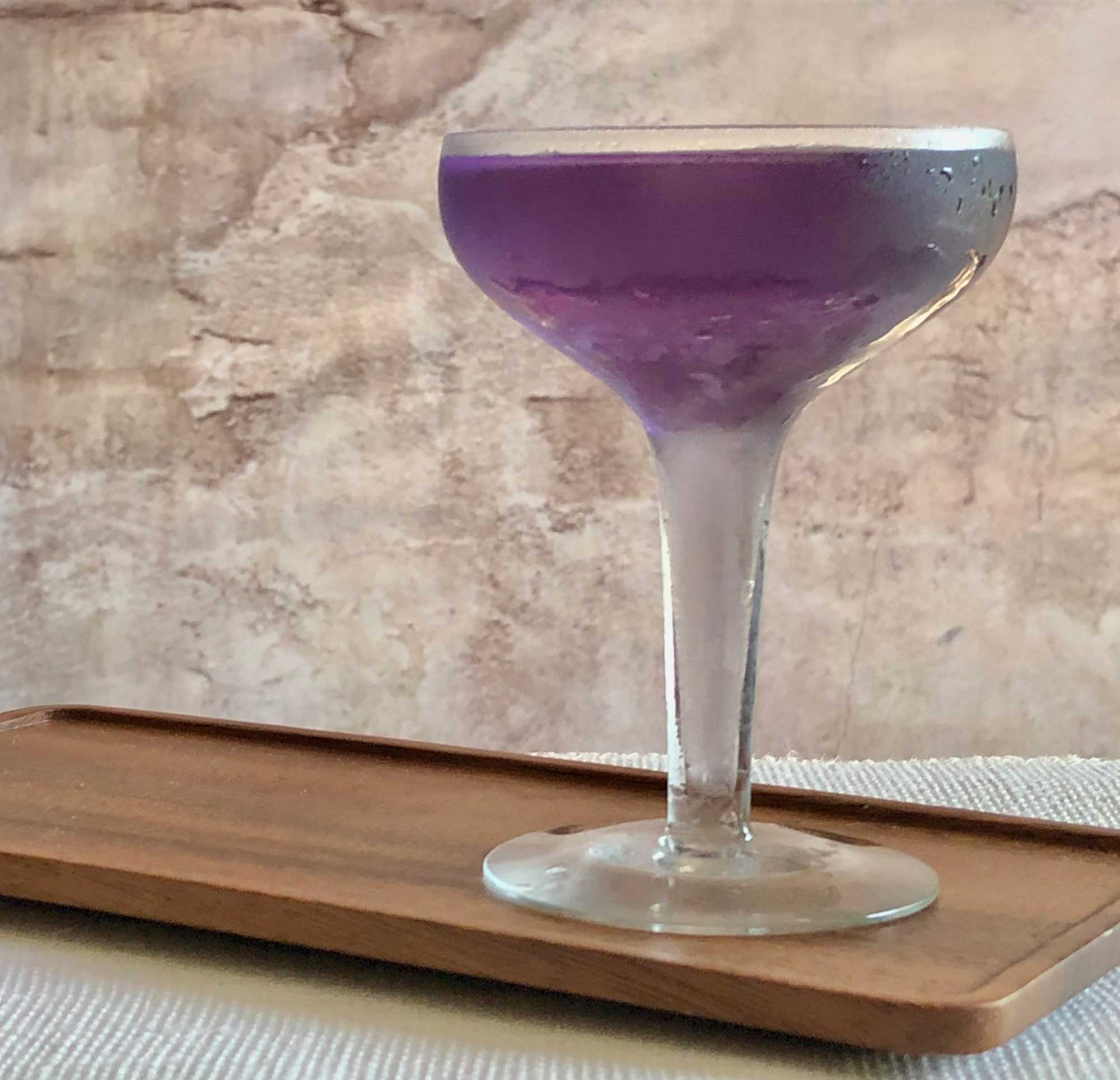 An example of the Night Flights, the mixed drink (cocktail), by Andra Johnson, Washington D.C., featuring Hayman’s London Dry Gin, vodka, Salers Gentian Apéritif, and Rothman & Winter Crème de Violette; photo by Lee Edwards